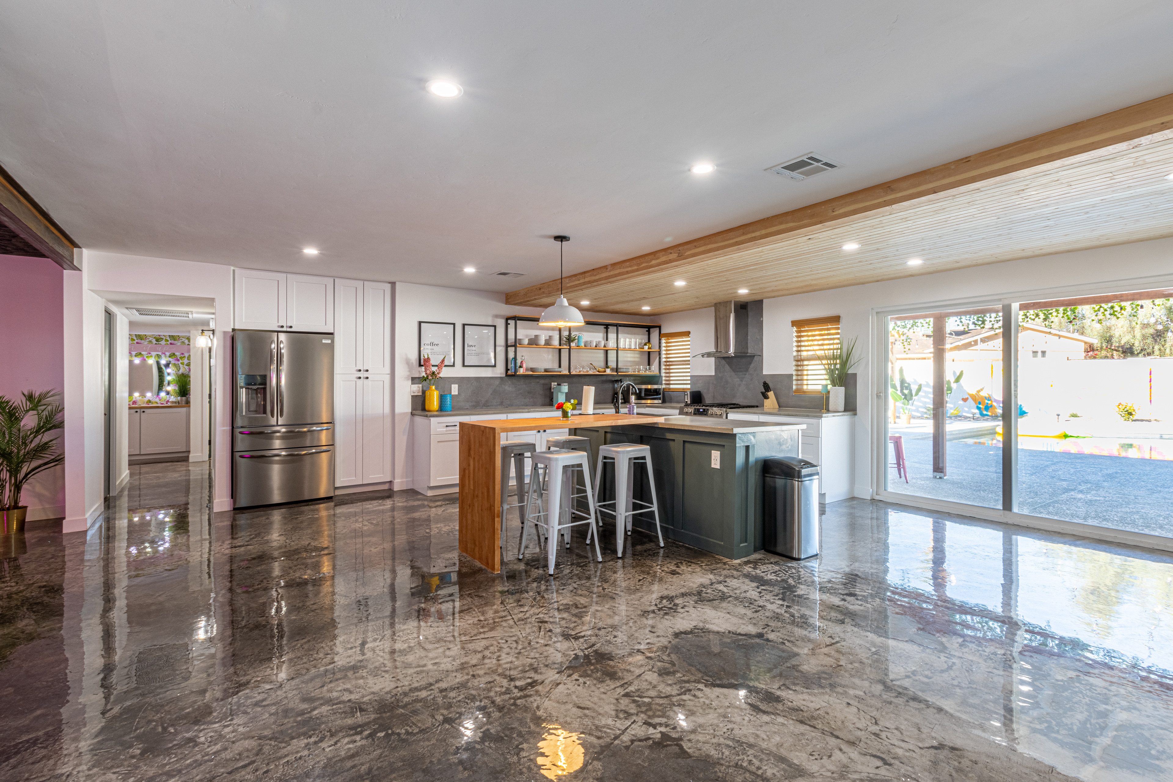 Open kitchen and living area with polished concrete floors
