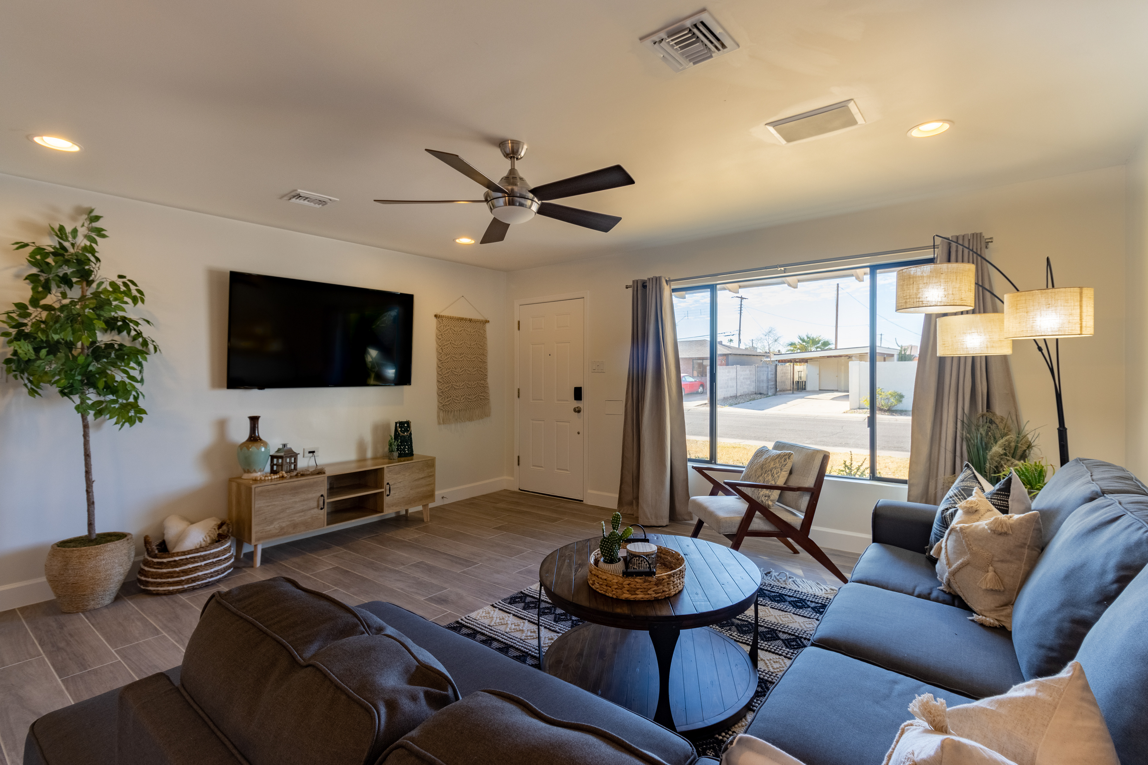 Living room with sectional and ceiling fan