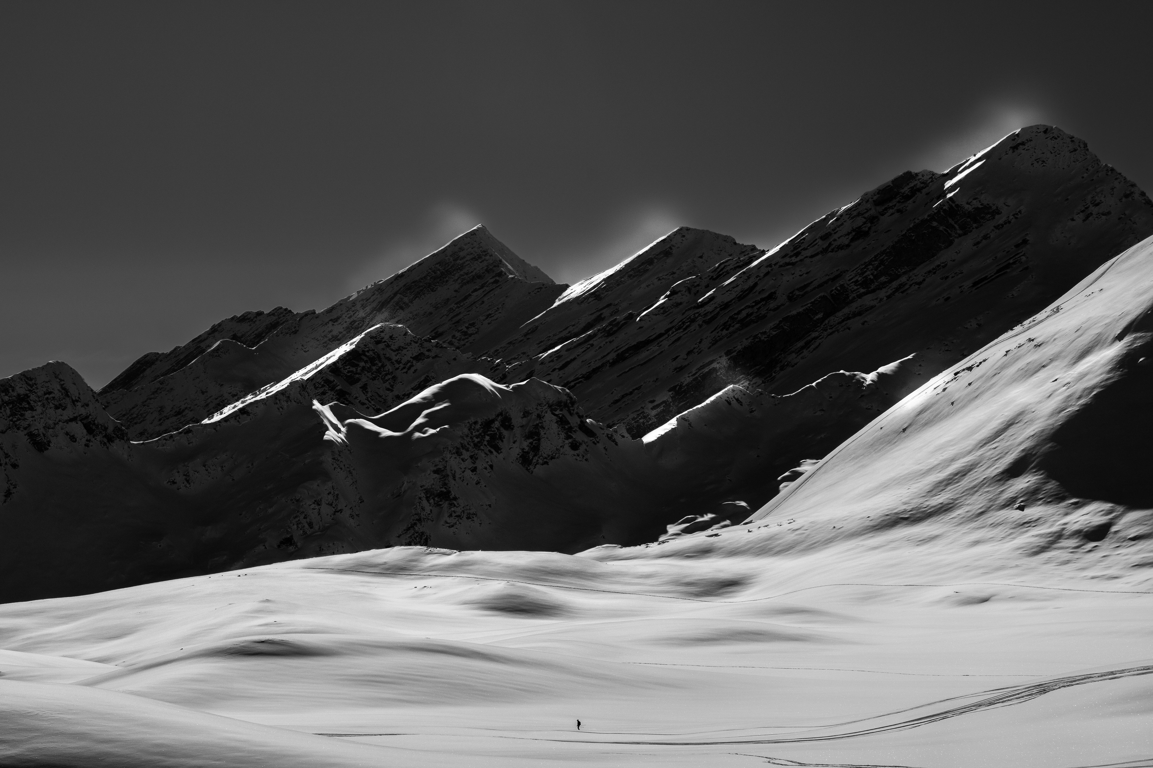 Among Waves of Snow and Tsunamis of Mountains