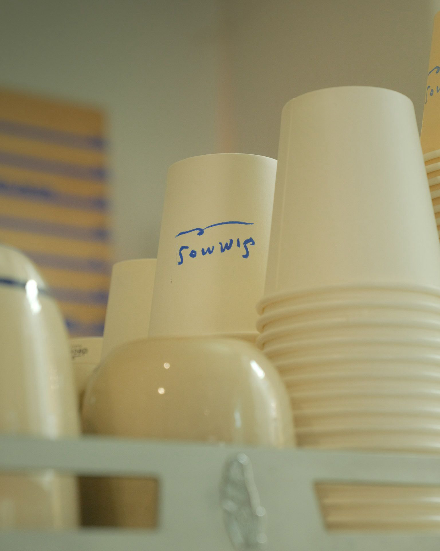 Simmos logo design on cup by HA-AH Design