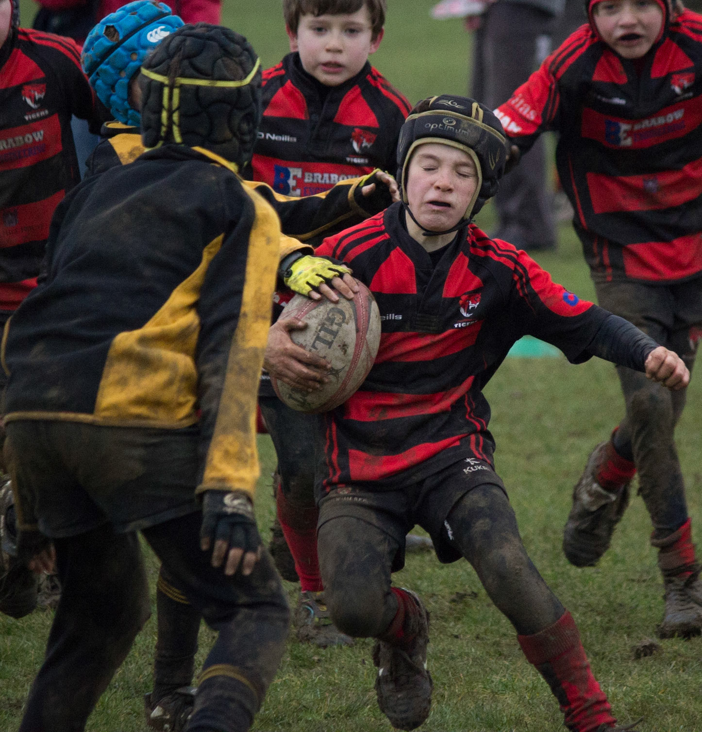 Young rubgy player about to be tackled in match for Cheltenham Tigers against Matson