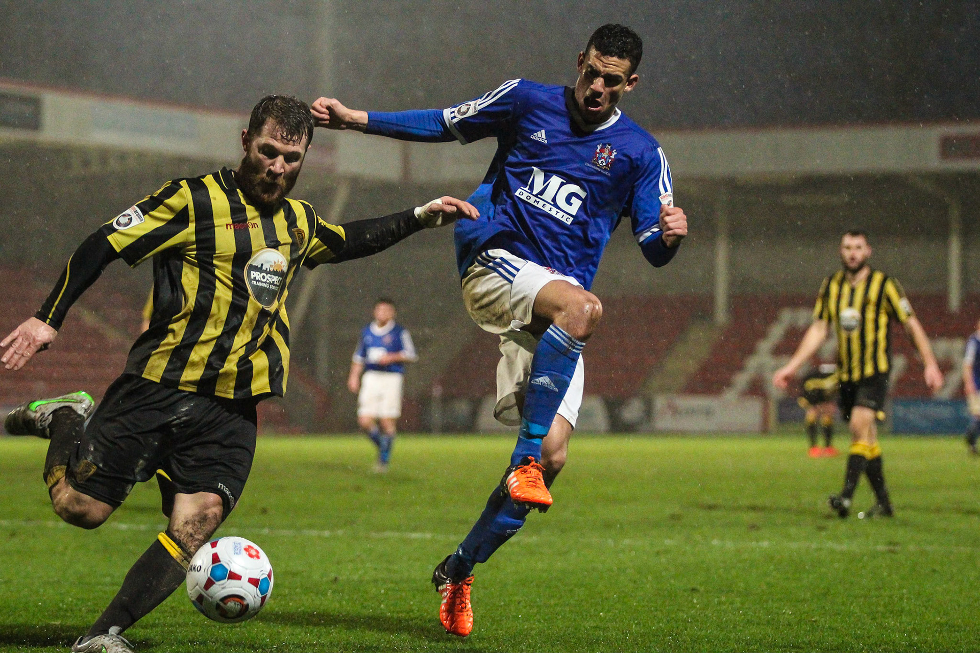 Defensive clearance from Gloucester v Stalybridge
