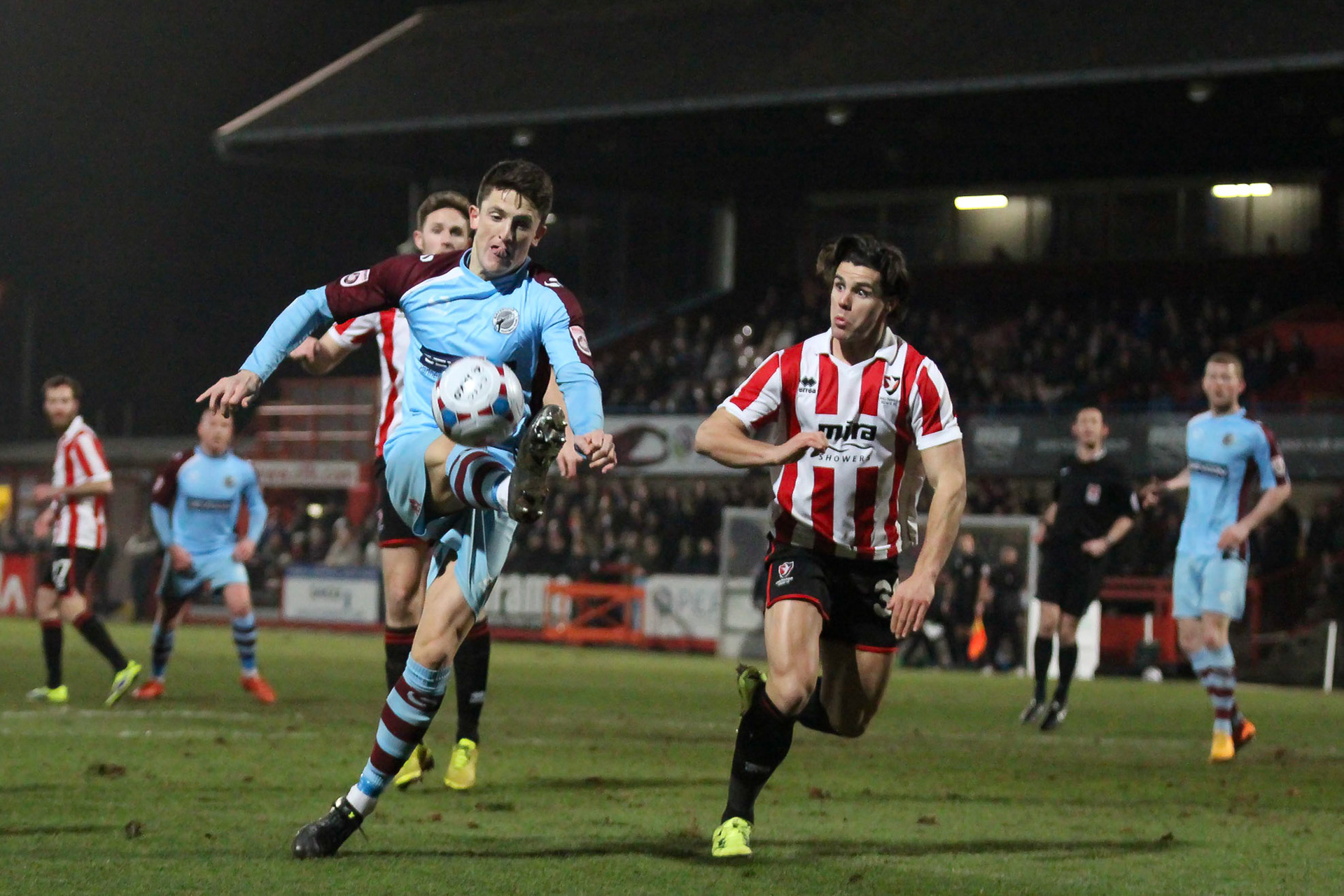 Through bacll being controlled by Grimsby Town player with Dan Homan in close attendance in 2015/2016 promotion season