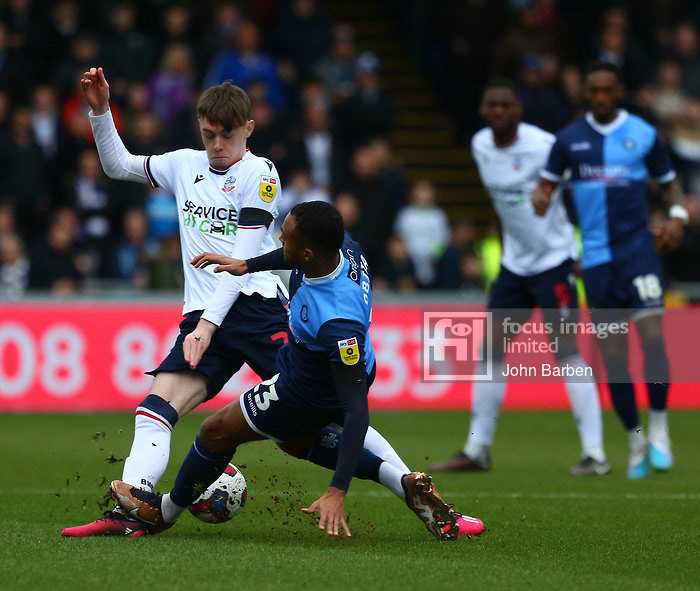 Jack Grimmer of Wycombe Wanderers fouls Conor Bradley of Bolton Wanderers during the Sky Bet League 1 match at Adams Park, High WycombePicture by John Barben/Focus Images Ltd 07973 42002218/02/2023