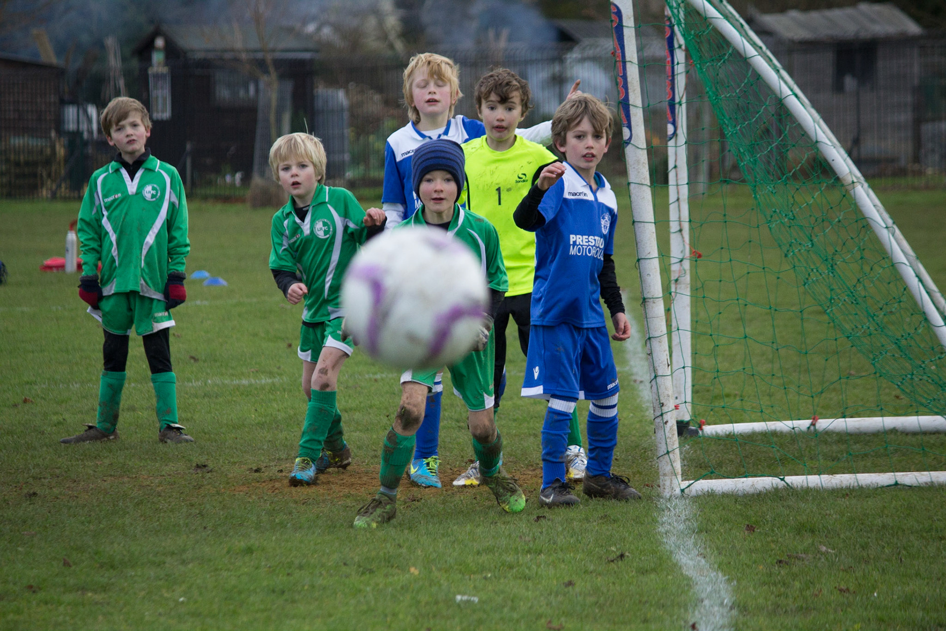 Youth football team Leckhampton Rovers watch a corner being taken by Prestbury Phantoms