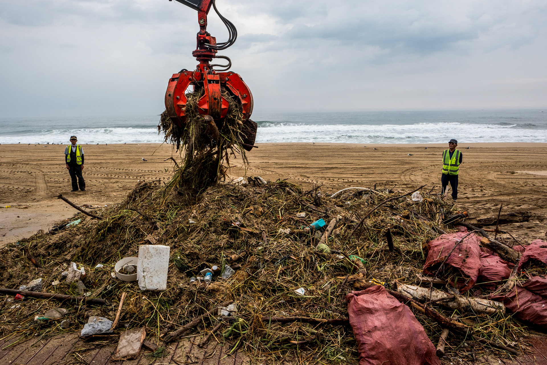 A forklift from beach cleaning company collects trash from the sand at Gyeongpo Beach in Gangneung, Gangwon Province, South Korea, August 12, 2023. Tropical Typhoon Kanun caused heavy rain and strong winds in most parts of the country from the 9th to the 11th. In Gangwon-do, a very strong wind blew with a maximum instantaneous wind speed of more than 80 km/h. The wave height in Gangwon-do is currently 1.5m to 4m. Matrix Images/Lee Kitae
