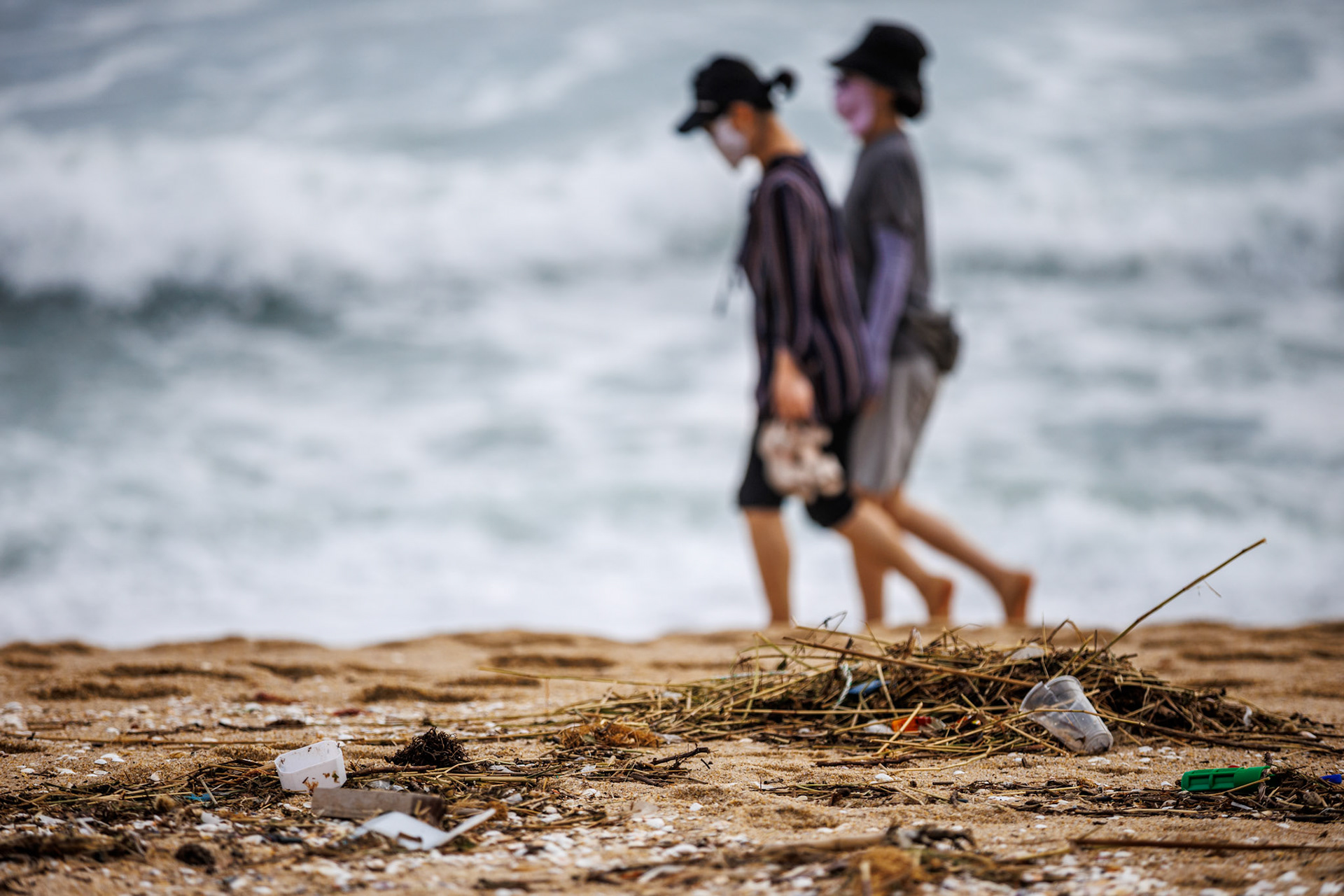 Travelers walk along the beach at Songjeong Beach in Gangneung City, Gangwon Province, South Korea, August 12, 2023. Tropical Typhoon Kanun caused heavy rain and strong winds in most parts of the country from the 9th to the 11th. In Gangwon-do, a very strong wind blew with a maximum instantaneous wind speed of more than 80 km/h. The wave height in Gangwon-do is currently 1.5m to 4m. Matrix Images/Lee Kitae