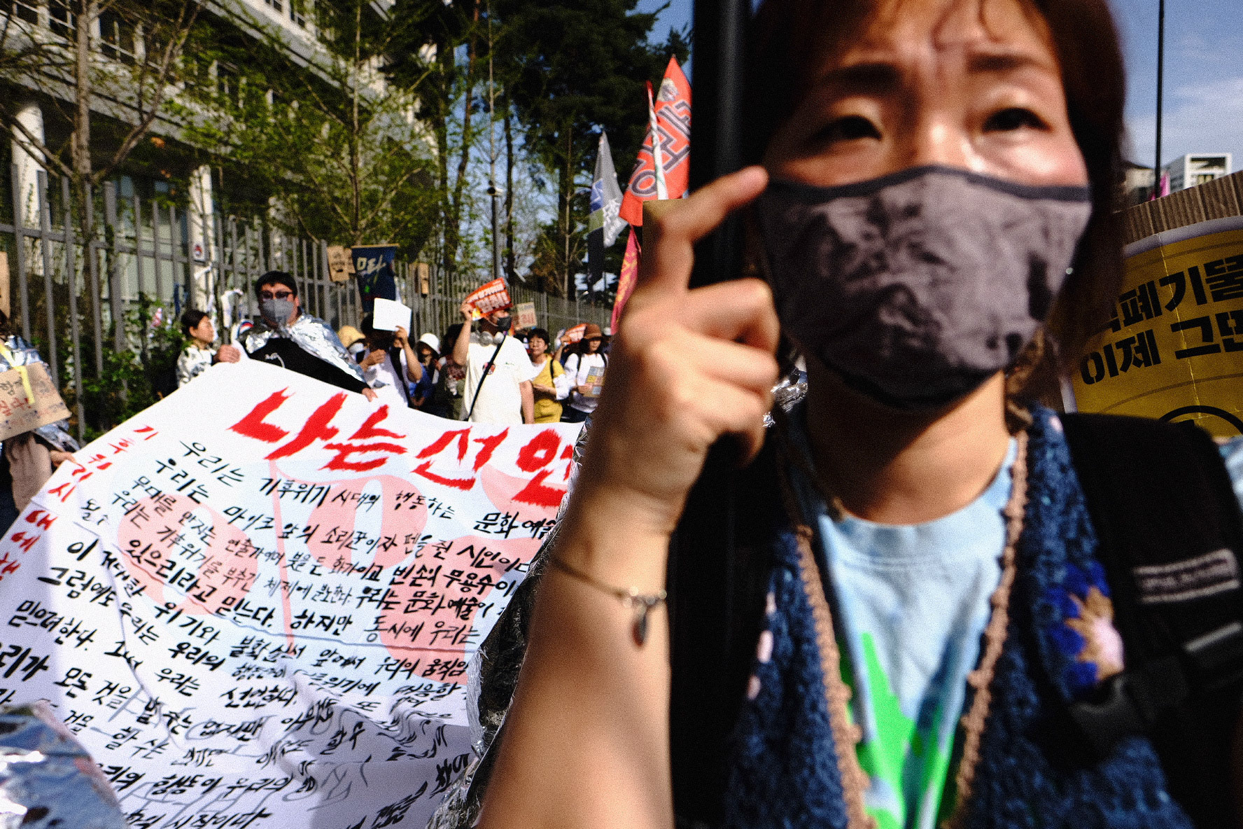 414 Climate Justice protesters march in front of the Sejong Government Complex in Sejong, Republic of Korea, April 14, 2023. Matrix Images/Lee Kitae