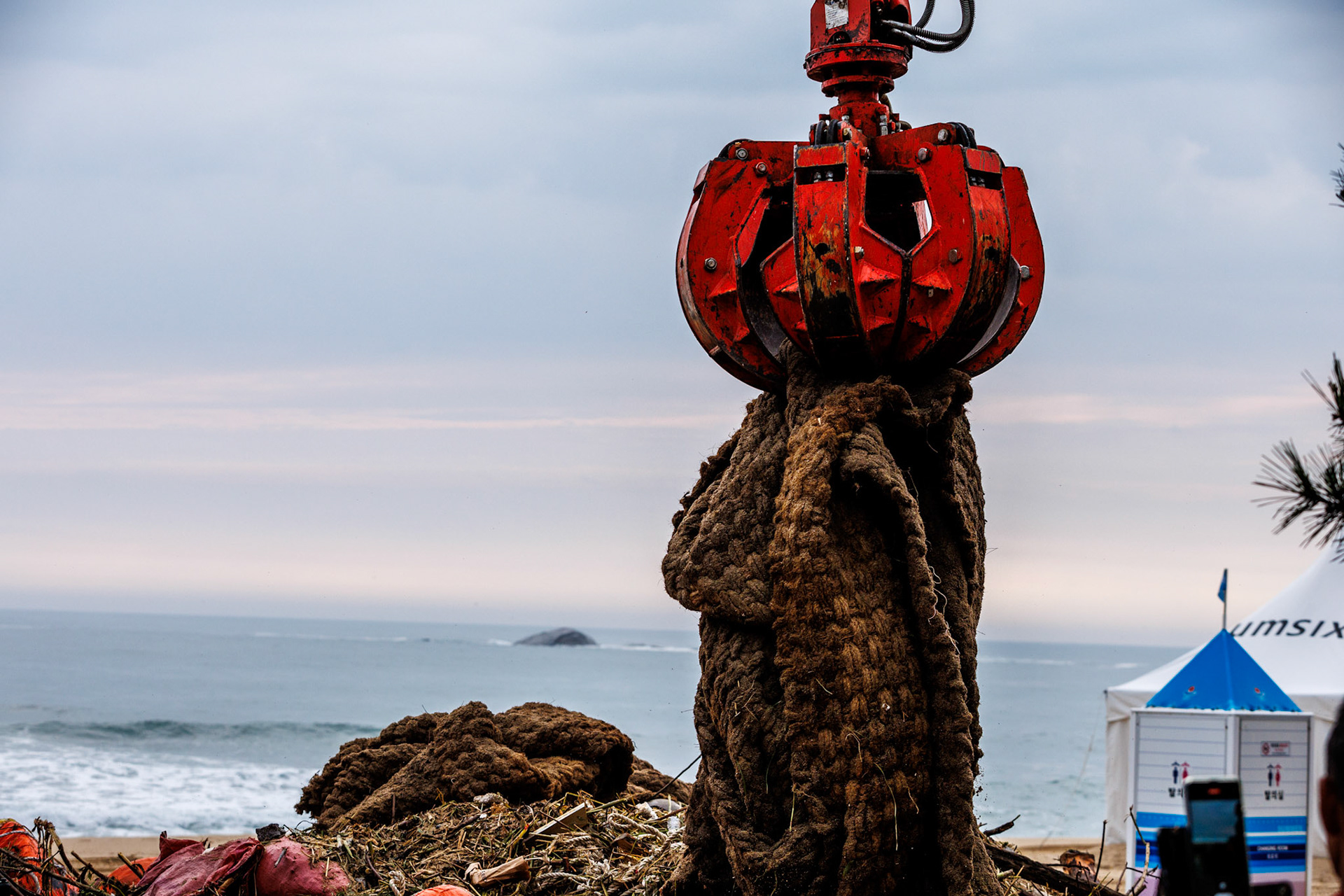 A forklift from beach cleaning company collects trash from the sand at Gyeongpo Beach in Gangneung, Gangwon Province, South Korea, August 12, 2023. Tropical Typhoon Kanun caused heavy rain and strong winds in most parts of the country from the 9th to the 11th. In Gangwon-do, a very strong wind blew with a maximum instantaneous wind speed of more than 80 km/h. The wave height in Gangwon-do is currently 1.5m to 4m. Matrix Images/Lee Kitae