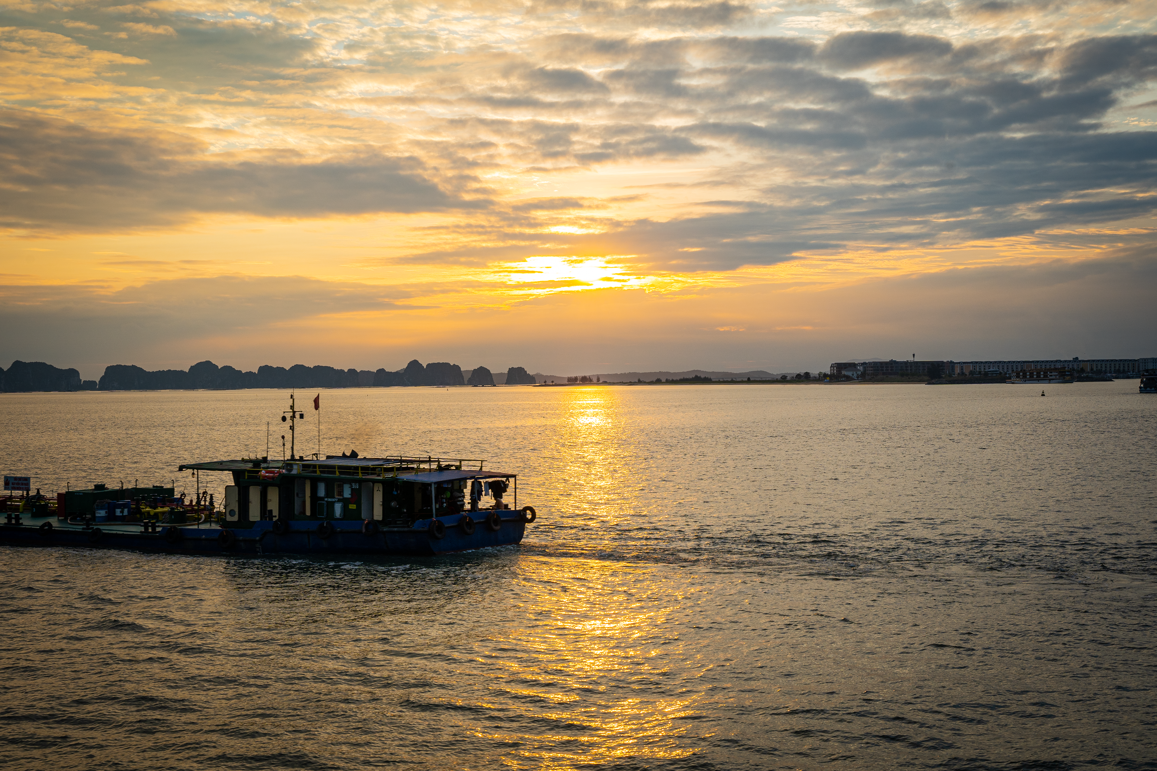 Sunset on our way back from Hạ Long Bay.