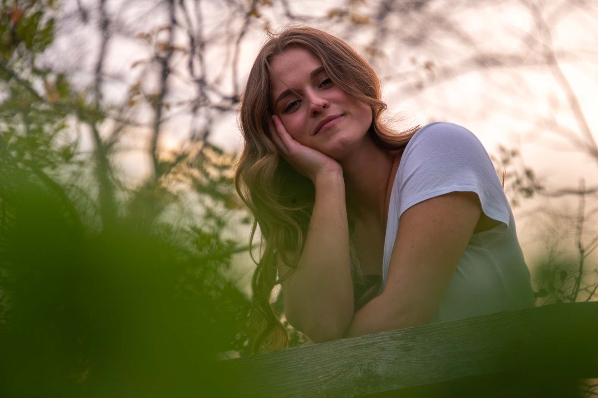 Olena Makhnovets, 18, poses in various locations across Western Kentucky University's campus on March 28, 2025. Following weeks of unpredictable weather, the campus was covered in white and pink as cherry blossom trees began to bloom.