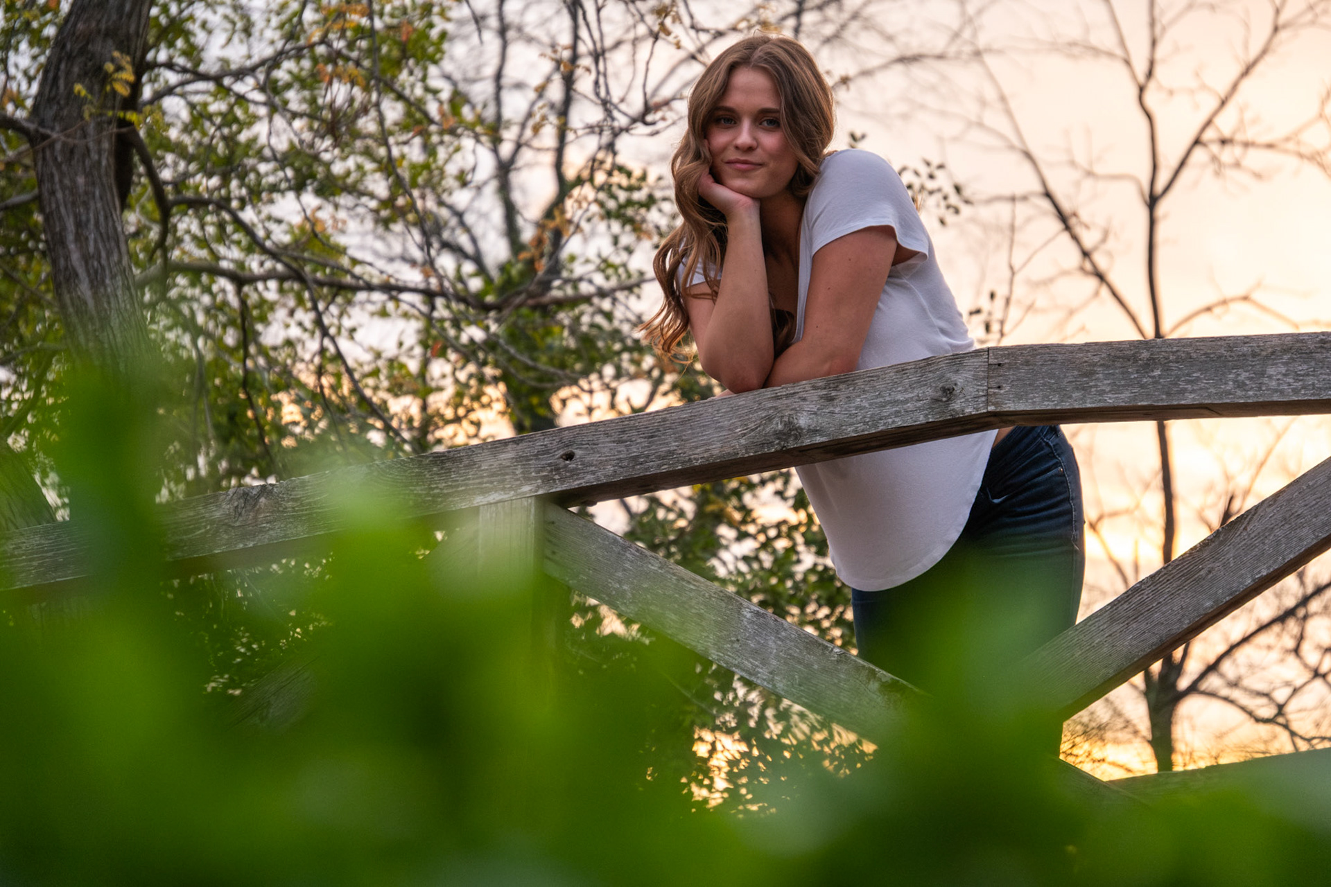 Olena Makhnovets, 18, poses in various locations across Western Kentucky University's campus on March 28, 2025. Following weeks of unpredictable weather, the campus was covered in white and pink as cherry blossom trees began to bloom.