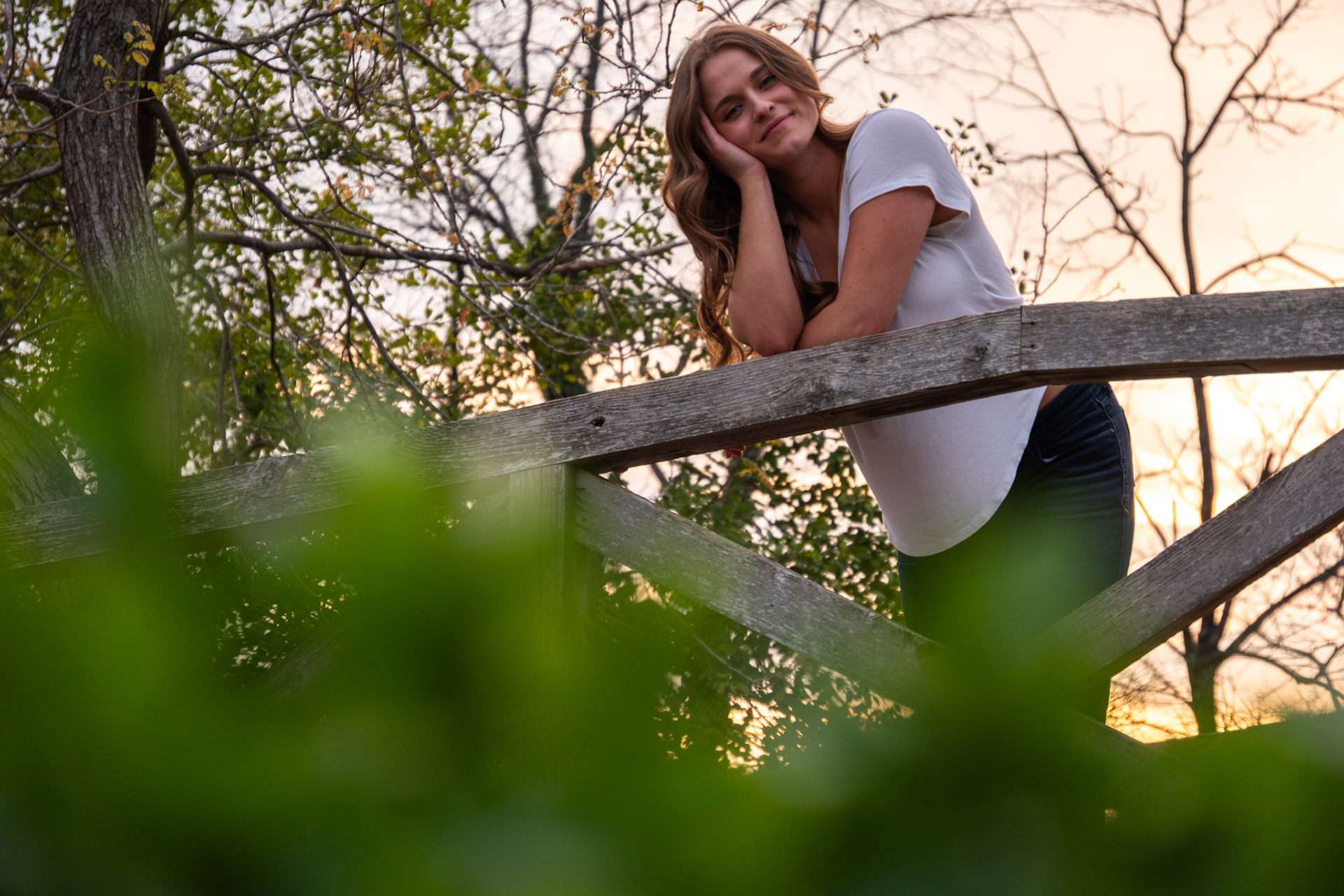 Olena Makhnovets, 18, poses in various locations across Western Kentucky University's campus on March 28, 2025. Following weeks of unpredictable weather, the campus was covered in white and pink as cherry blossom trees began to bloom.