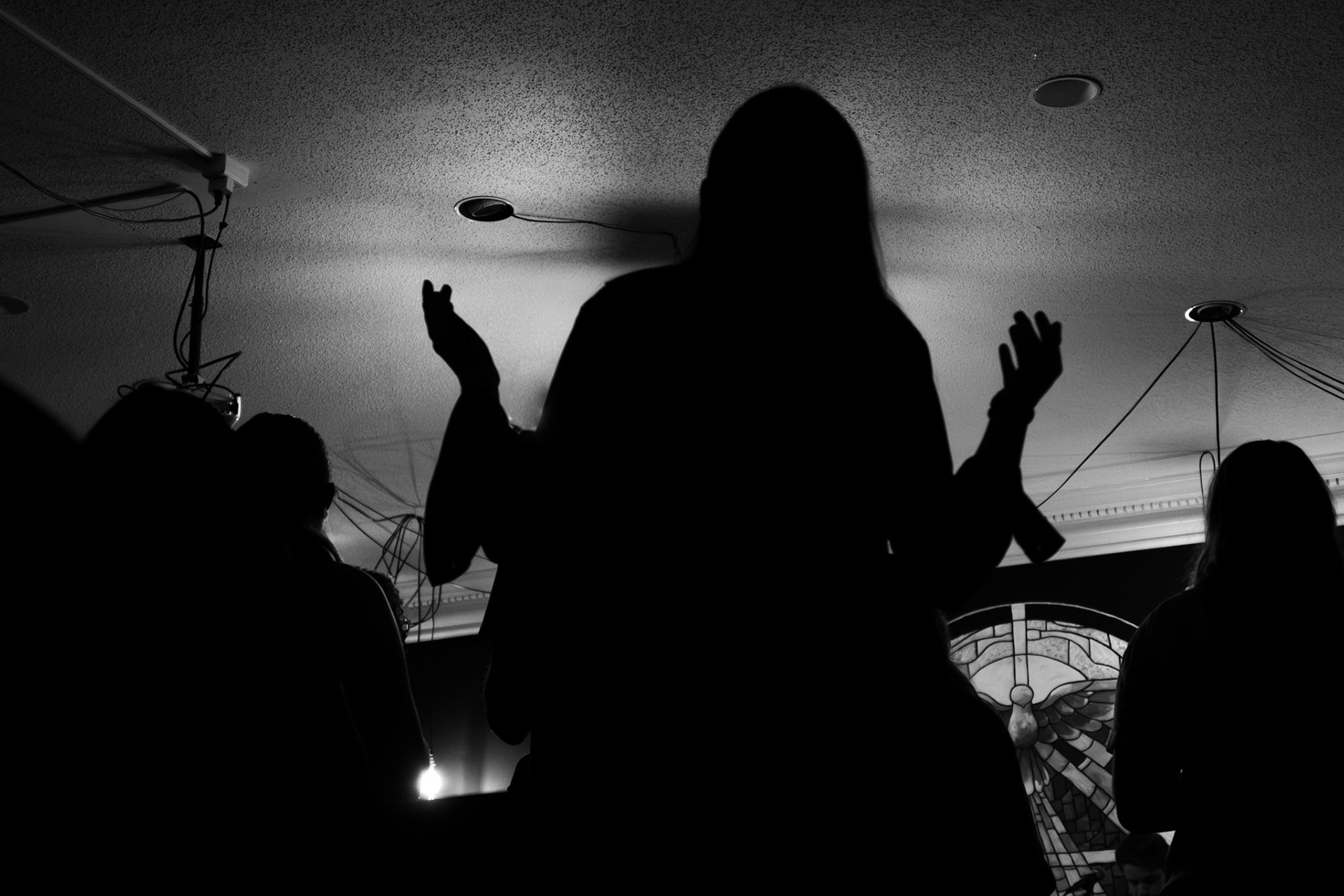 Marlowe Hanel raises her hands in worship on April 22.
