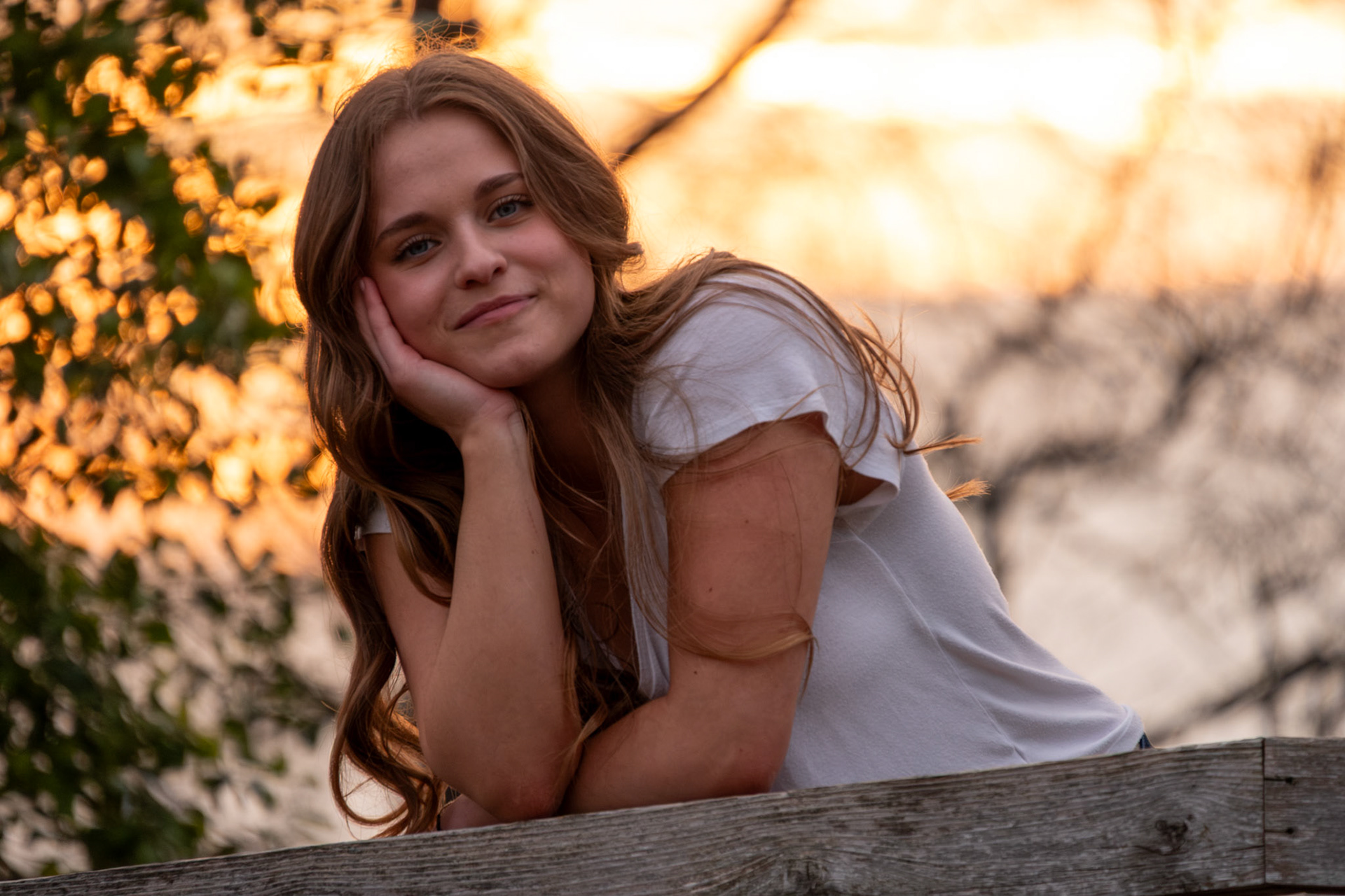 Olena Makhnovets, 18, poses in various locations across Western Kentucky University's campus on March 28, 2025. Following weeks of unpredictable weather, the campus was covered in white and pink as cherry blossom trees began to bloom.