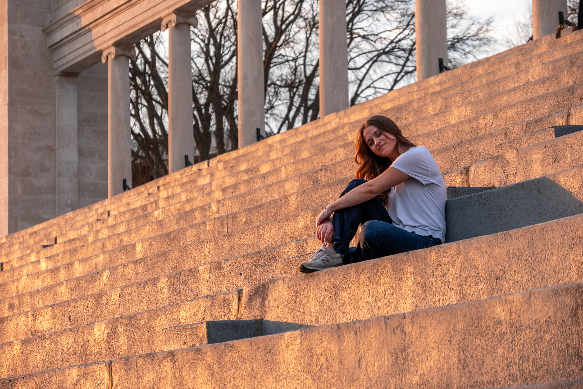 Olena Makhnovets, 18, poses in various locations across Western Kentucky University's campus on March 28, 2025. Following weeks of unpredictable weather, the campus was covered in white and pink as cherry blossom trees began to bloom.