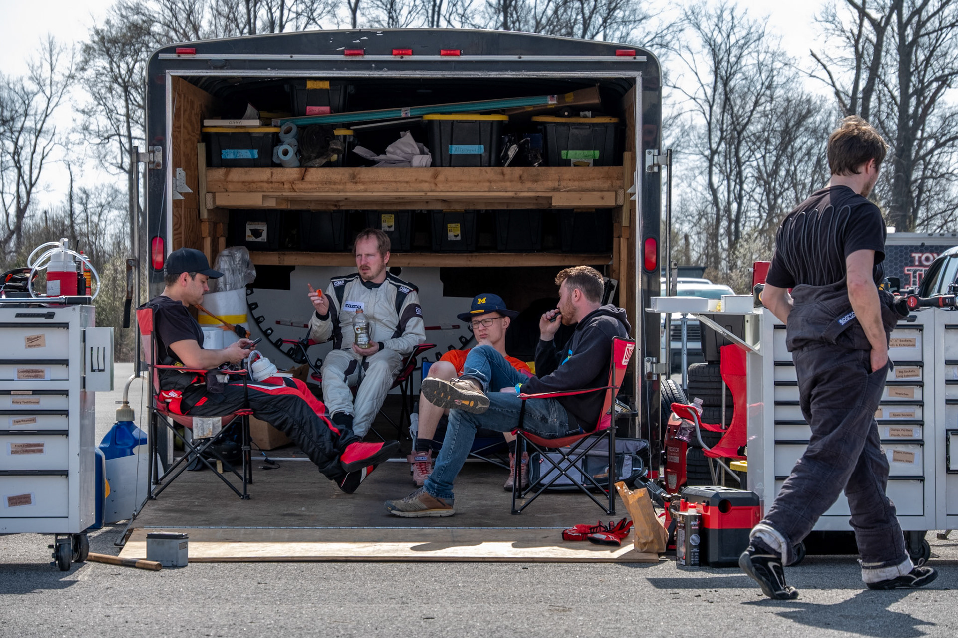 A team sits around prior to their race at NCM Motorsports on March 14.