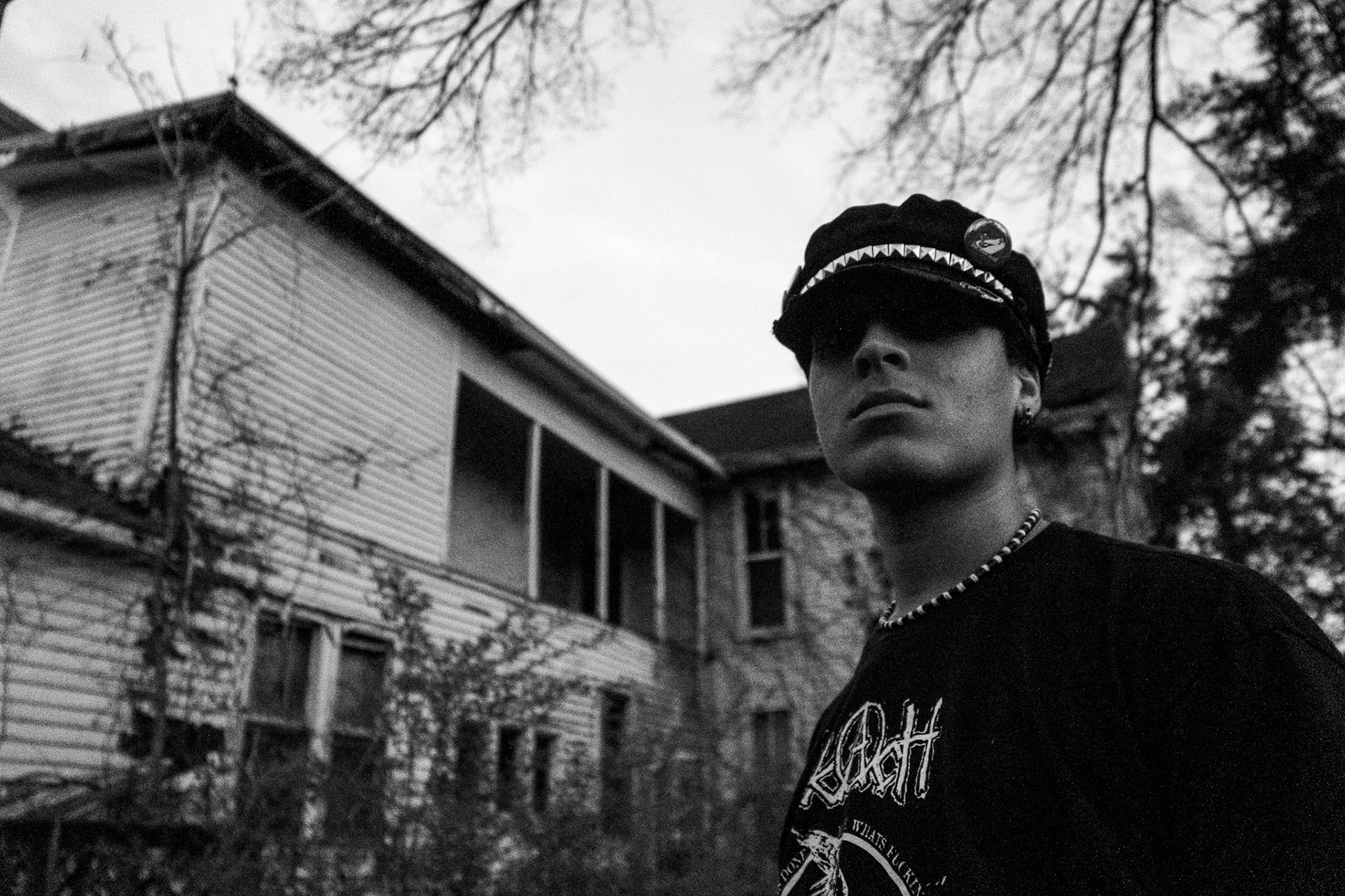 Braxton Brown poses around an abandoned building with his fellow "Farynx" band members on April 10.