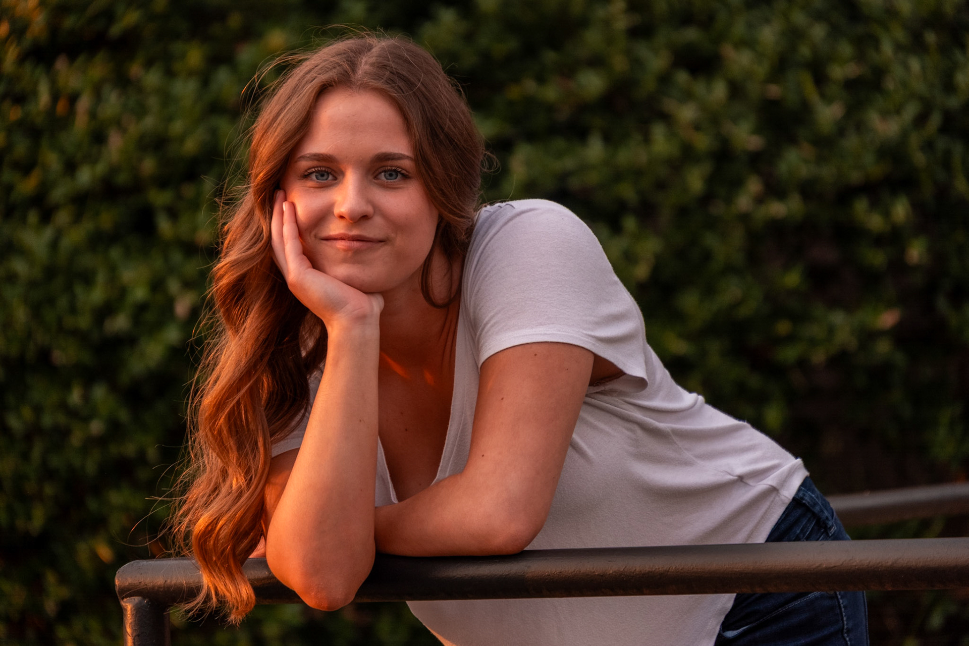 Olena Makhnovets, 18, poses in various locations across Western Kentucky University's campus on March 28, 2025. Following weeks of unpredictable weather, the campus was covered in white and pink as cherry blossom trees began to bloom.