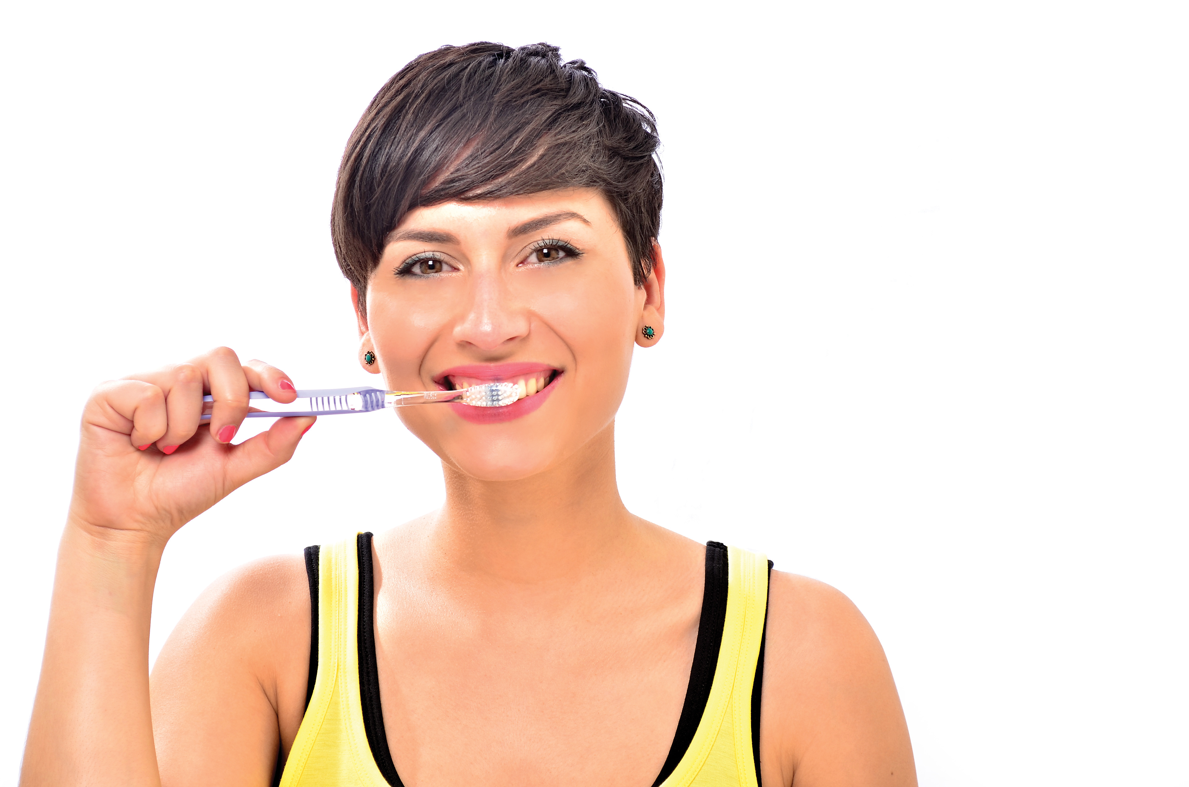Studio image of Brunette Female model showing dental hygene studio lighting