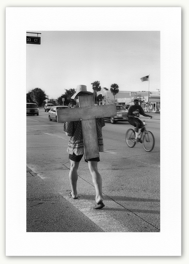 Steve Hanson Photography Man carrying a wooden cross, Florida, USA.
