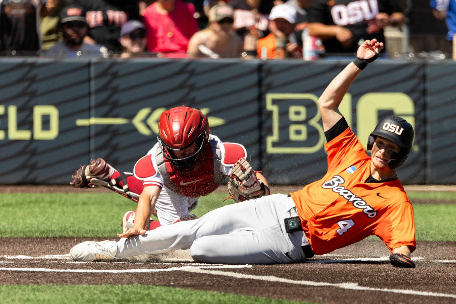 Runner slides to score