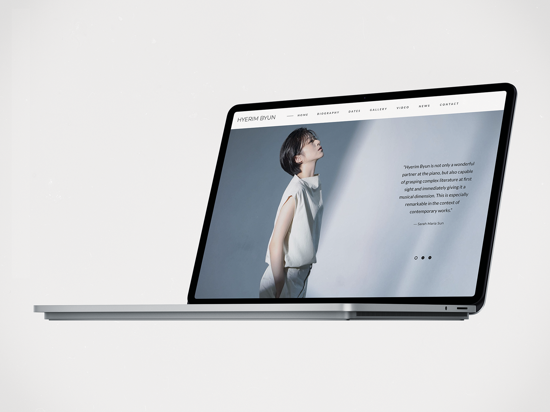 Homepage of hyerimbyun.com displayed on a laptop with white background and elegant artist portrait. Featuring testimonial and calm visual identity.