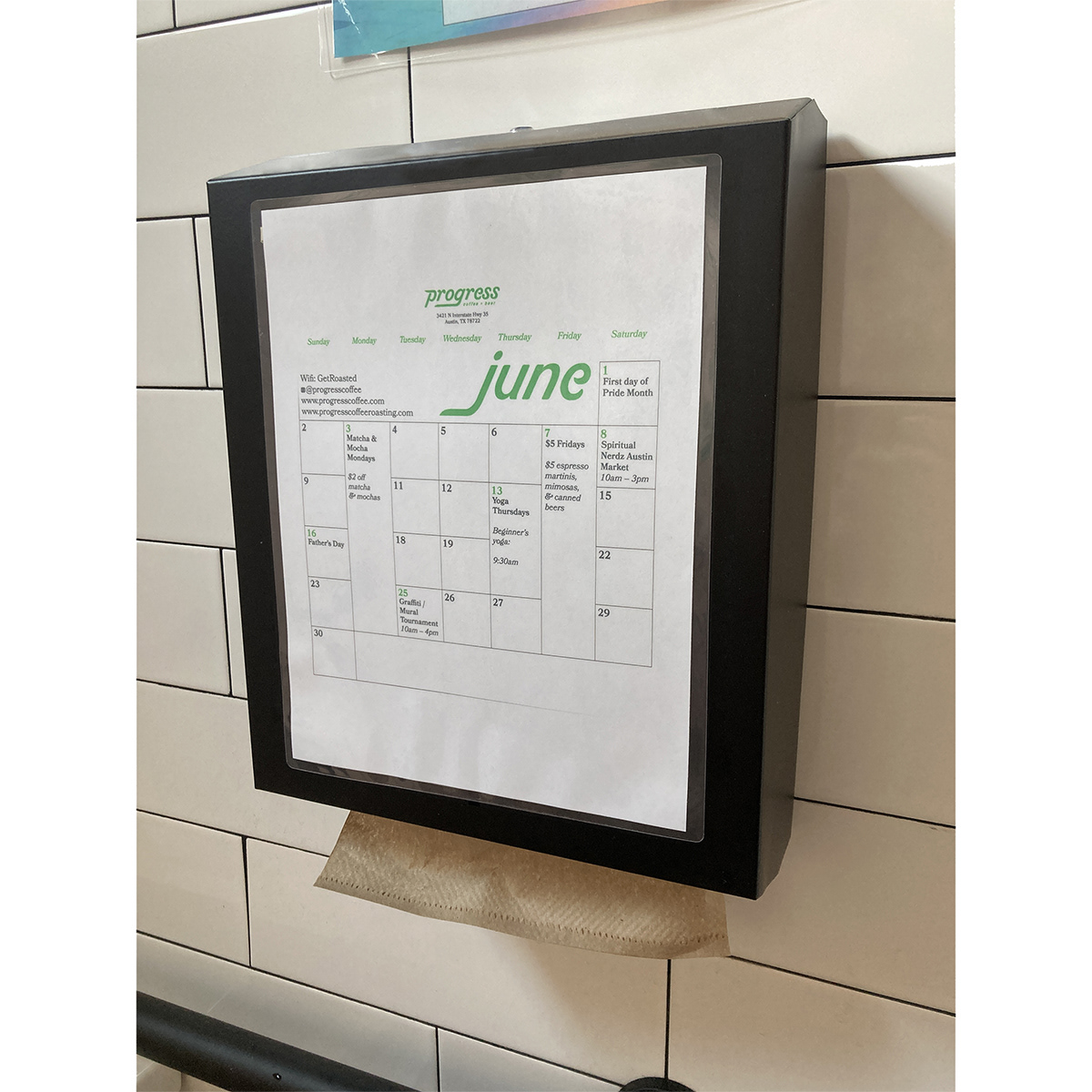 The June calendar on a paper towel dispenser