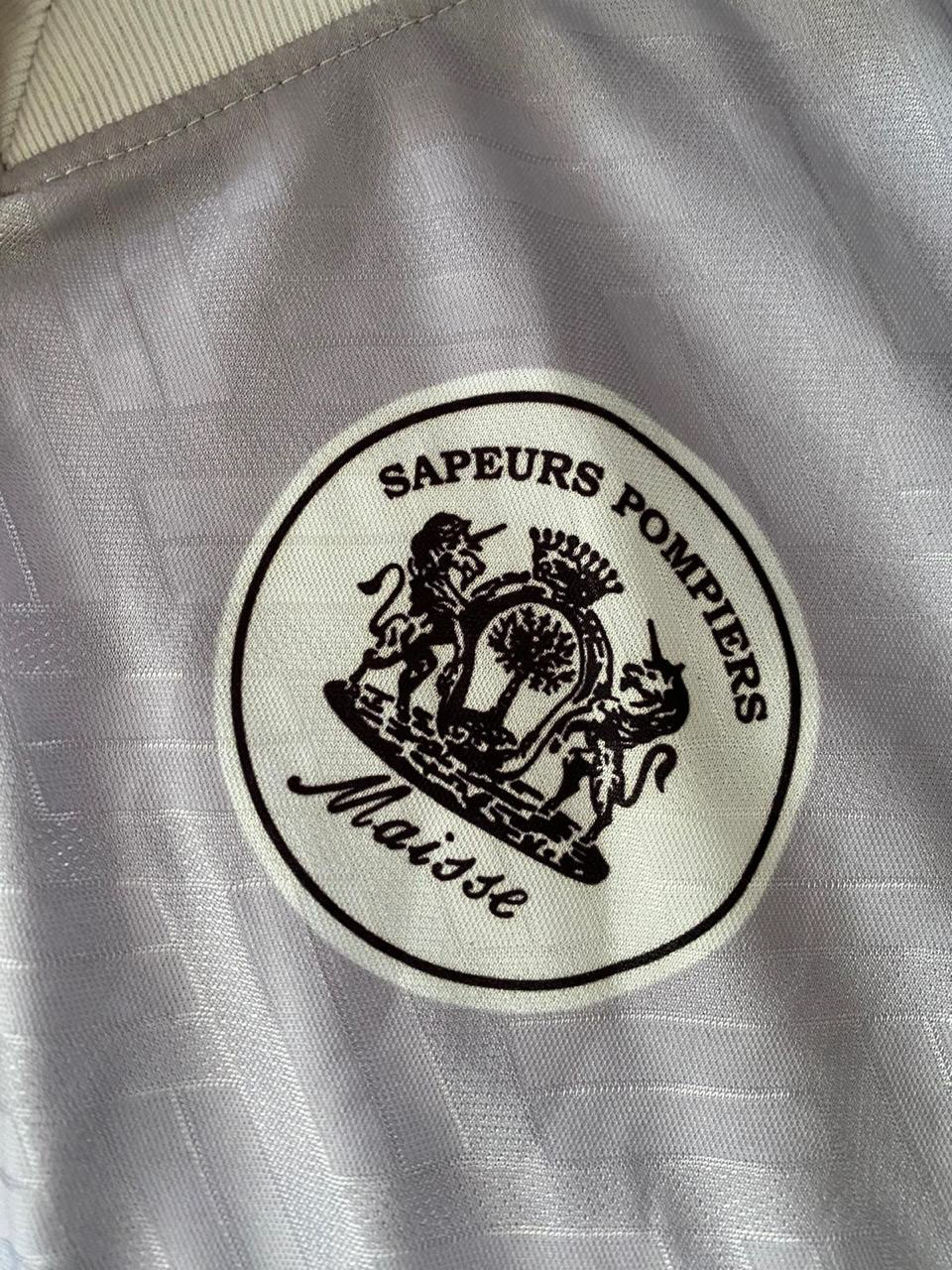 Références importantes pour les Jeunes Sapeurs Pompiers (Écusson de l’équipe de foot).