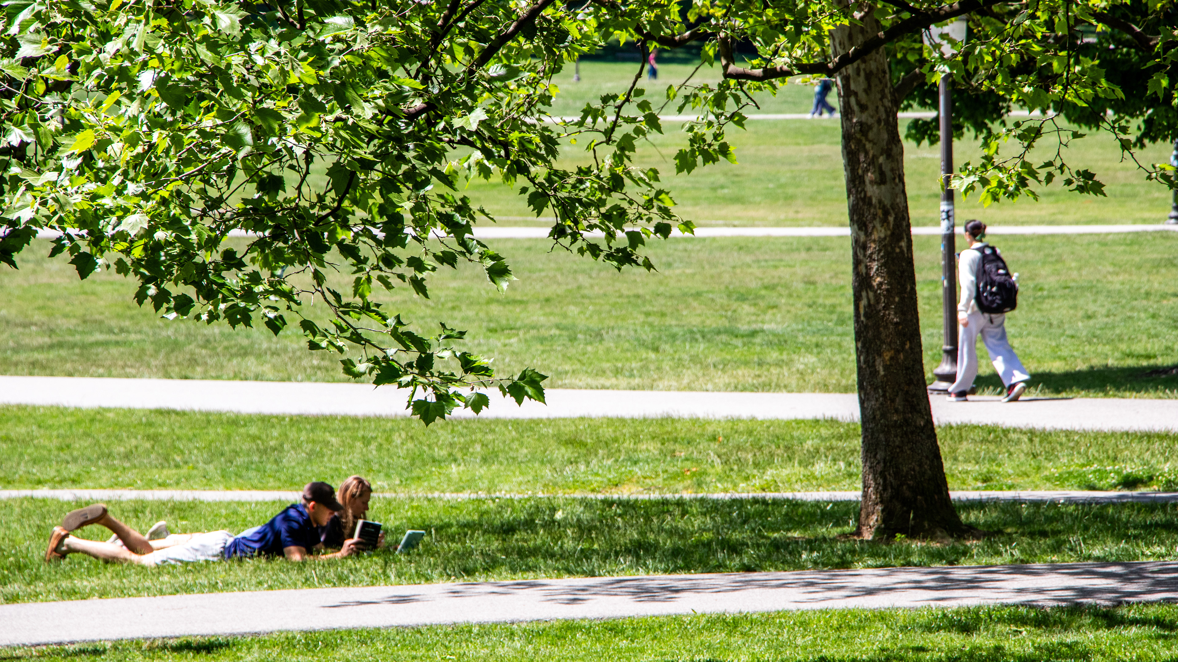 Blacksburg, Virginia, May 10, 2025 — Strength in Normalcy: Students relax and study on the Drillfield, which shows how VT has transformed from tragedy to a place of safety and everyday life. Photo: Michaela Scott