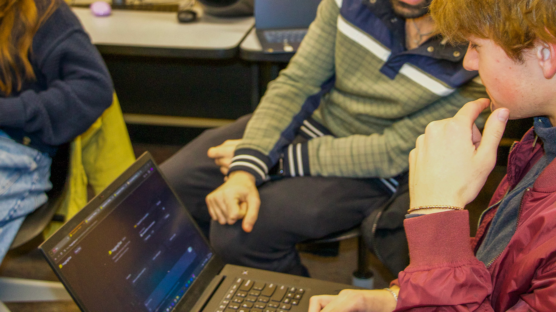 Blacksburg, Virginia, Feb. 19, 2025 --- Collaborative AI Learning: A student collaborates with a TA during an in-class activity exploring generative AI concepts and the latest chatbot technologies in Kim's course.
