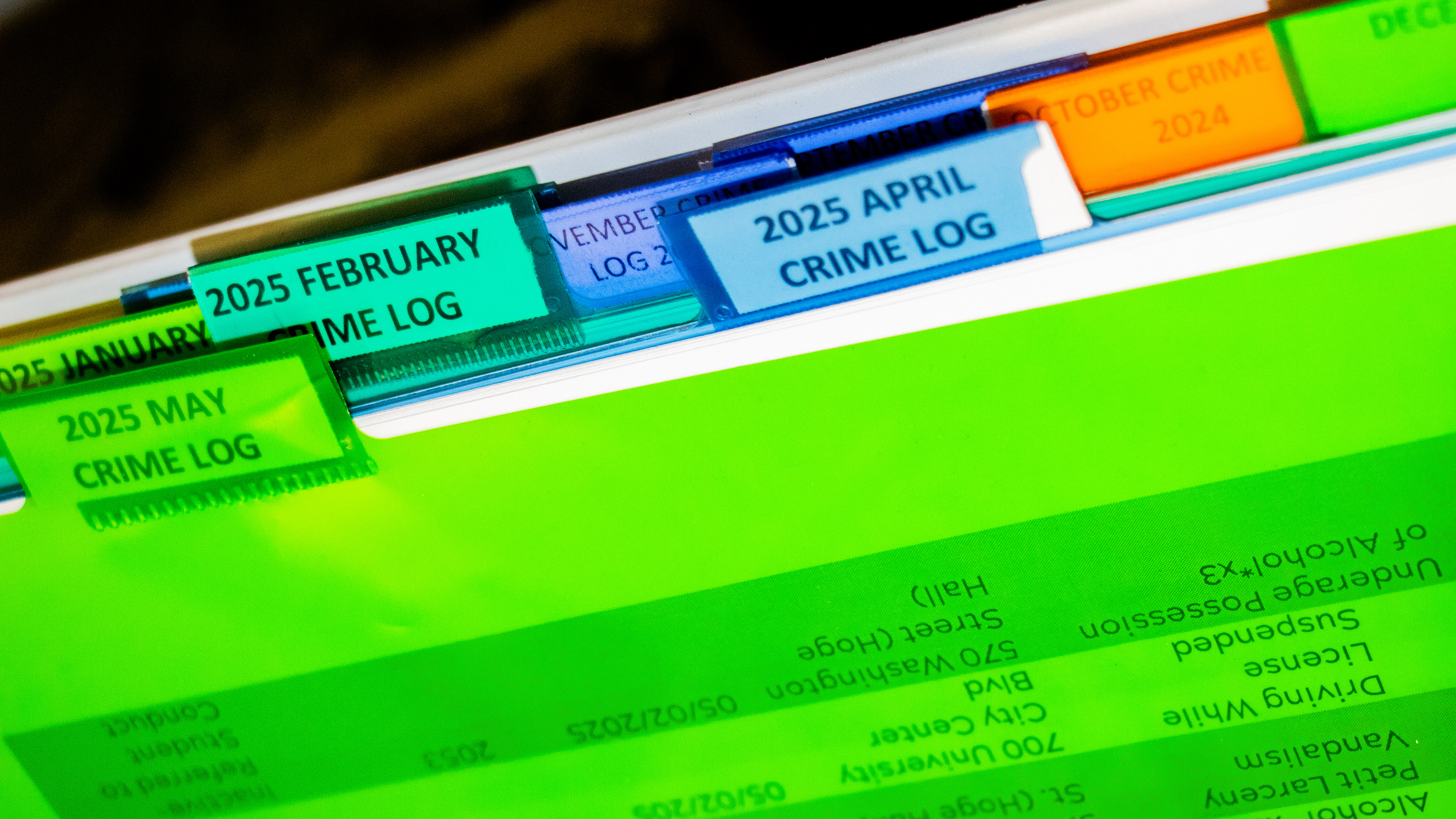 Blacksburg, Virginia, May 10, 2025 — Open Record: A binder in the VTPD lobby catalogs monthly crime reports, underscoring the department's transparency and dedication to public awareness. Photo: Michaela Scott
