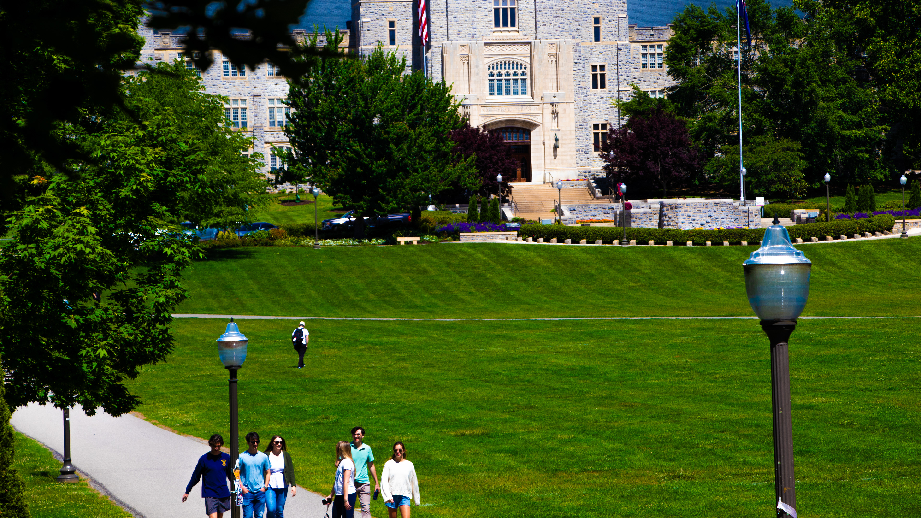 Blacksburg, Virginia, May 10, 2025 — Life on Campus: A lively group of students cross the Drillfield near Burruss Hall, embodying the spirit of resilience and unity that defines VT's journey of healing and remembrance. Photo: Michaela Scott