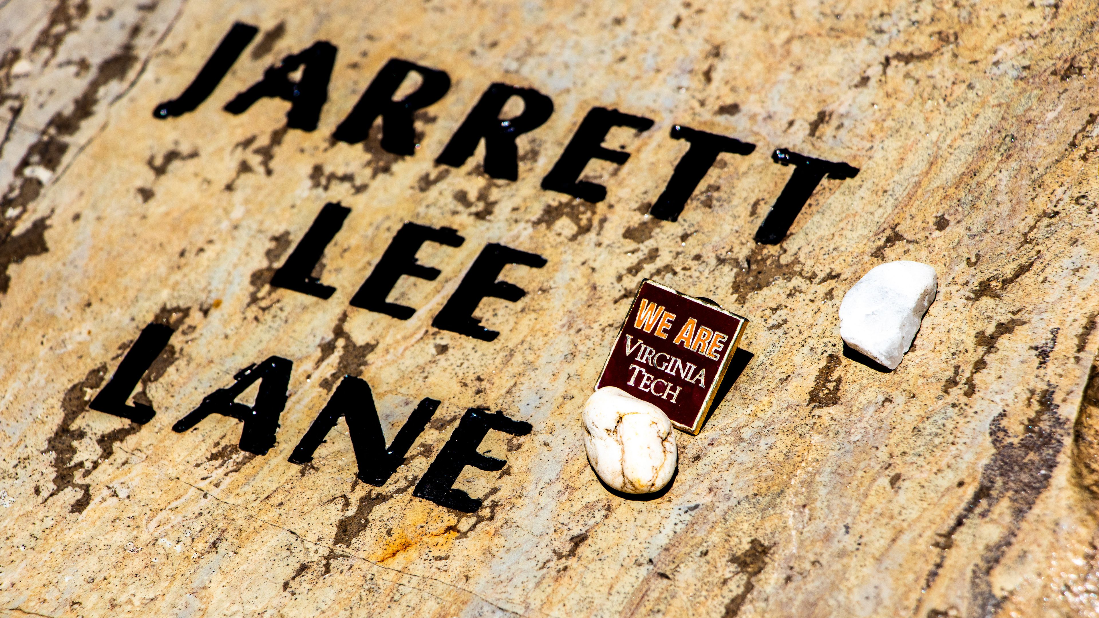 Blacksburg, Virginia, May 10, 2025 — Honoring Jarrett Lane: A close-up of the Hokie Stone at the April 16 Memorial marks the life and legacy of Jarrett Lee Lane, one of the 32 lives lost on April 16, 2007. Photo: Michaela Scott