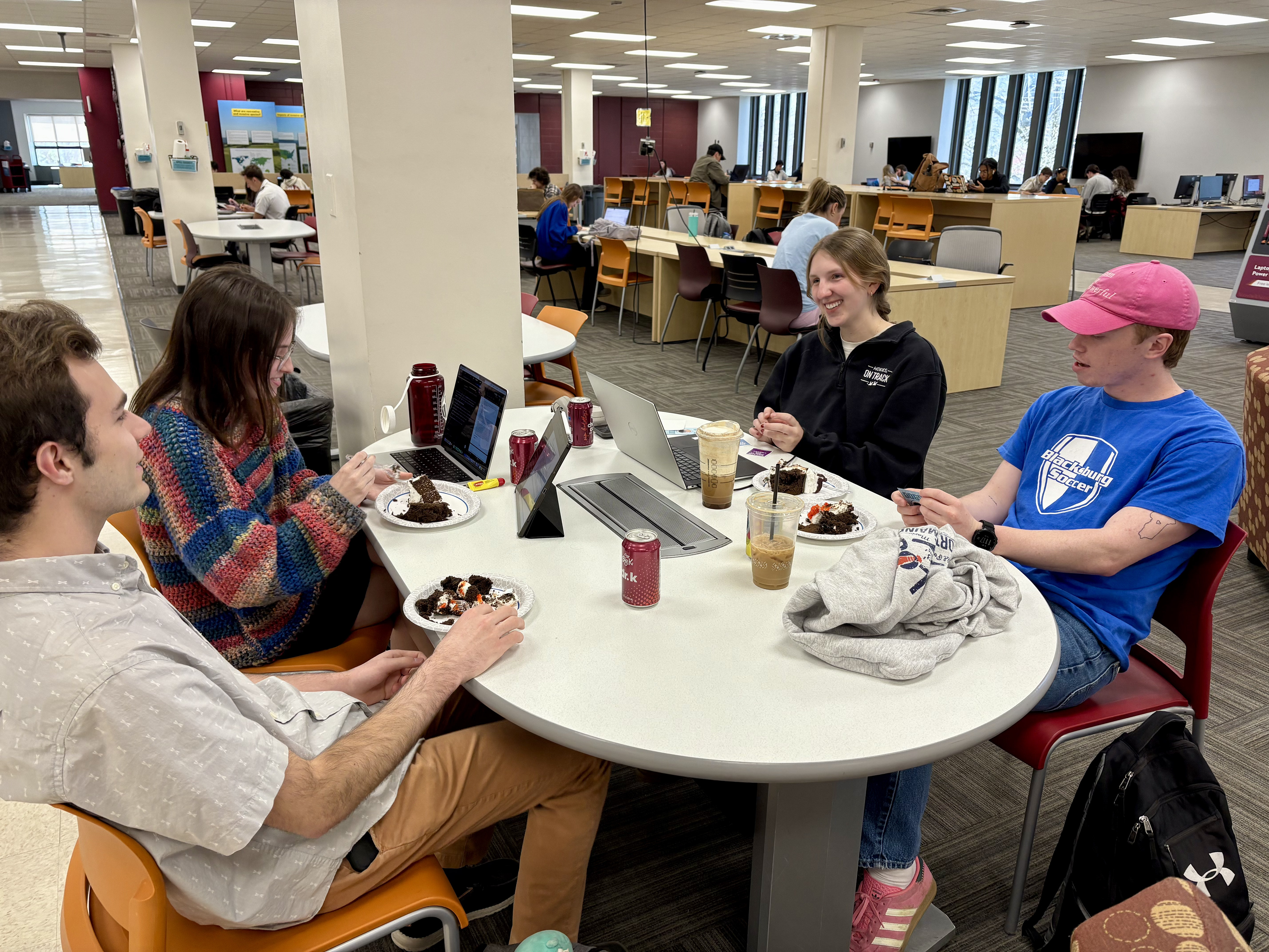 Blacksburg, Virginia, March 28, 2025 — Sharing Cake and Smiles: Students come together on the second story of Newman Library to enjoy Epcot’s birthday cake, and complete a couple assignments.