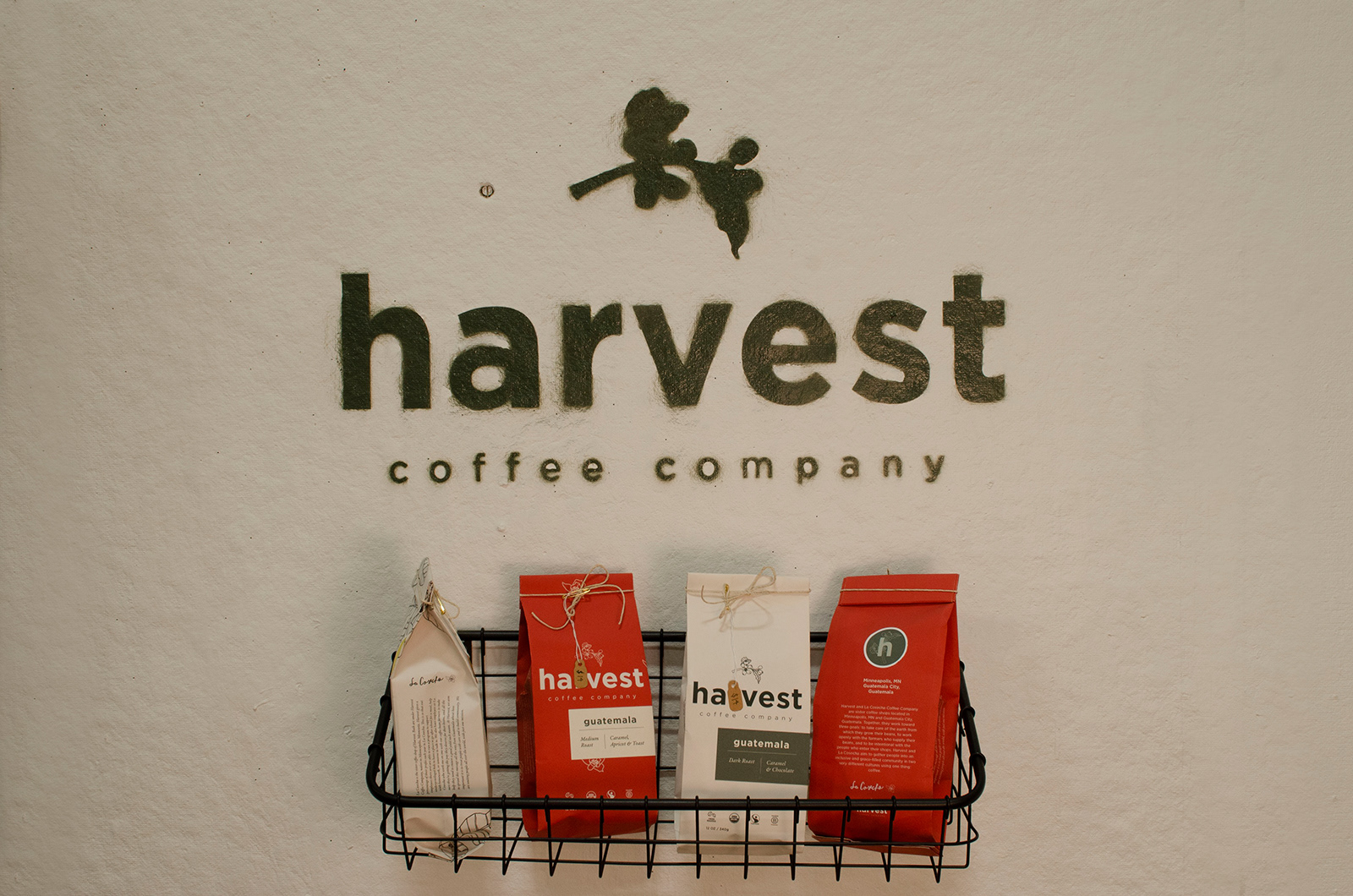 This is the logo spray painted, with the coffee bags displayed below. I designed, printed, and hand crafted each bag.