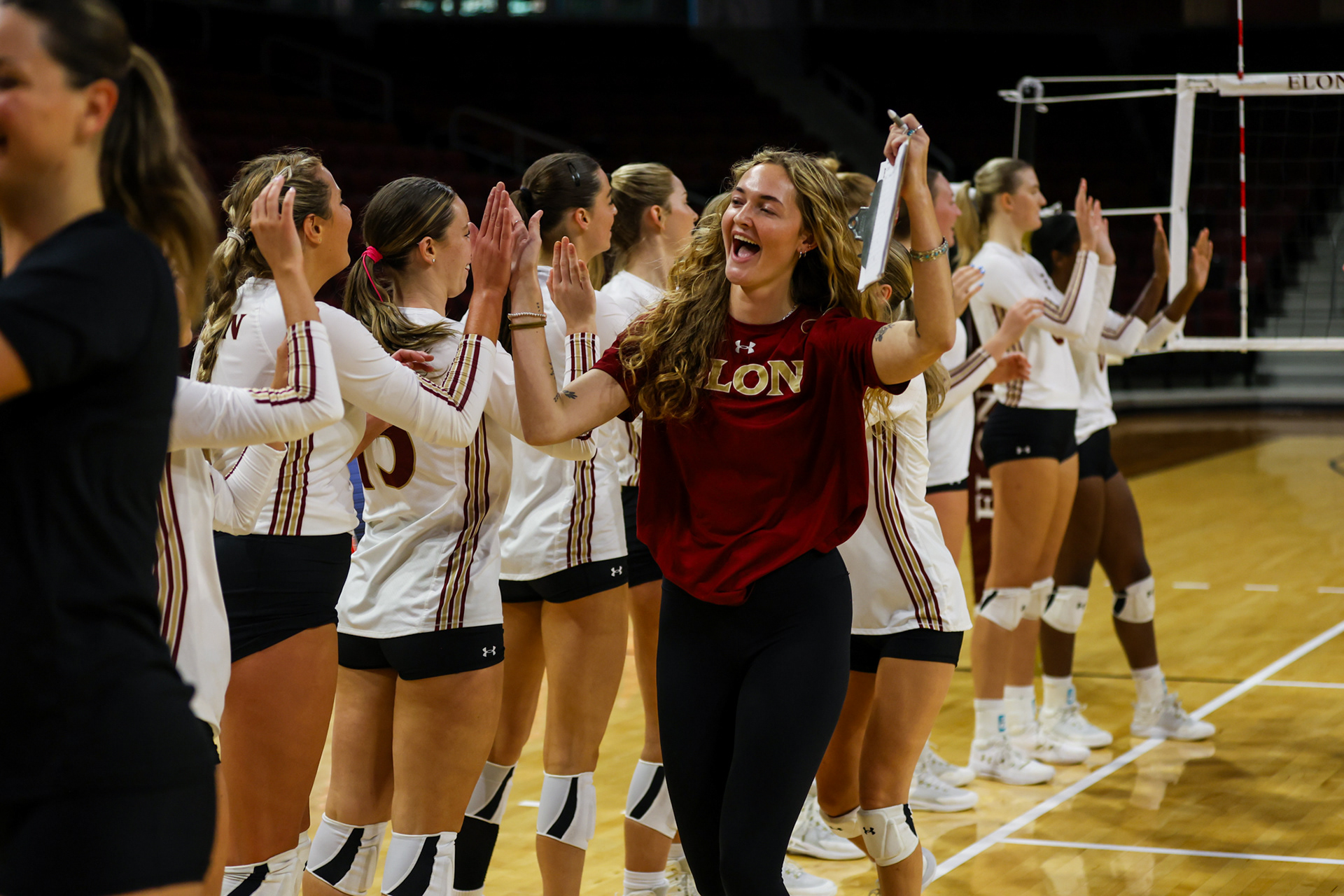 Presly Austin celebrates with her teammates after Elon’s first victory of the 2023 season on Sept. 8 against Western Carolina. Photo by Jacob Kisamore.