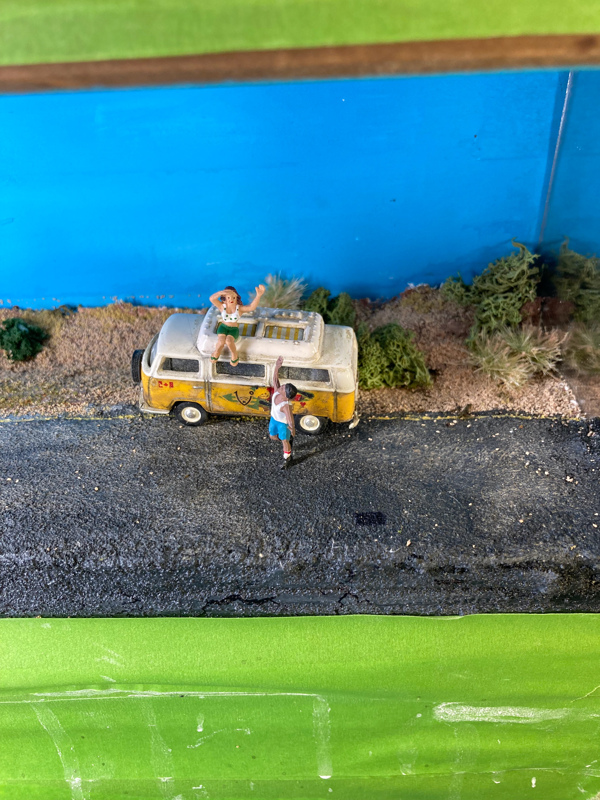 The road was painted in Vallejo Asphalt Texture, then further weathered with powders and a Sharpie pen.