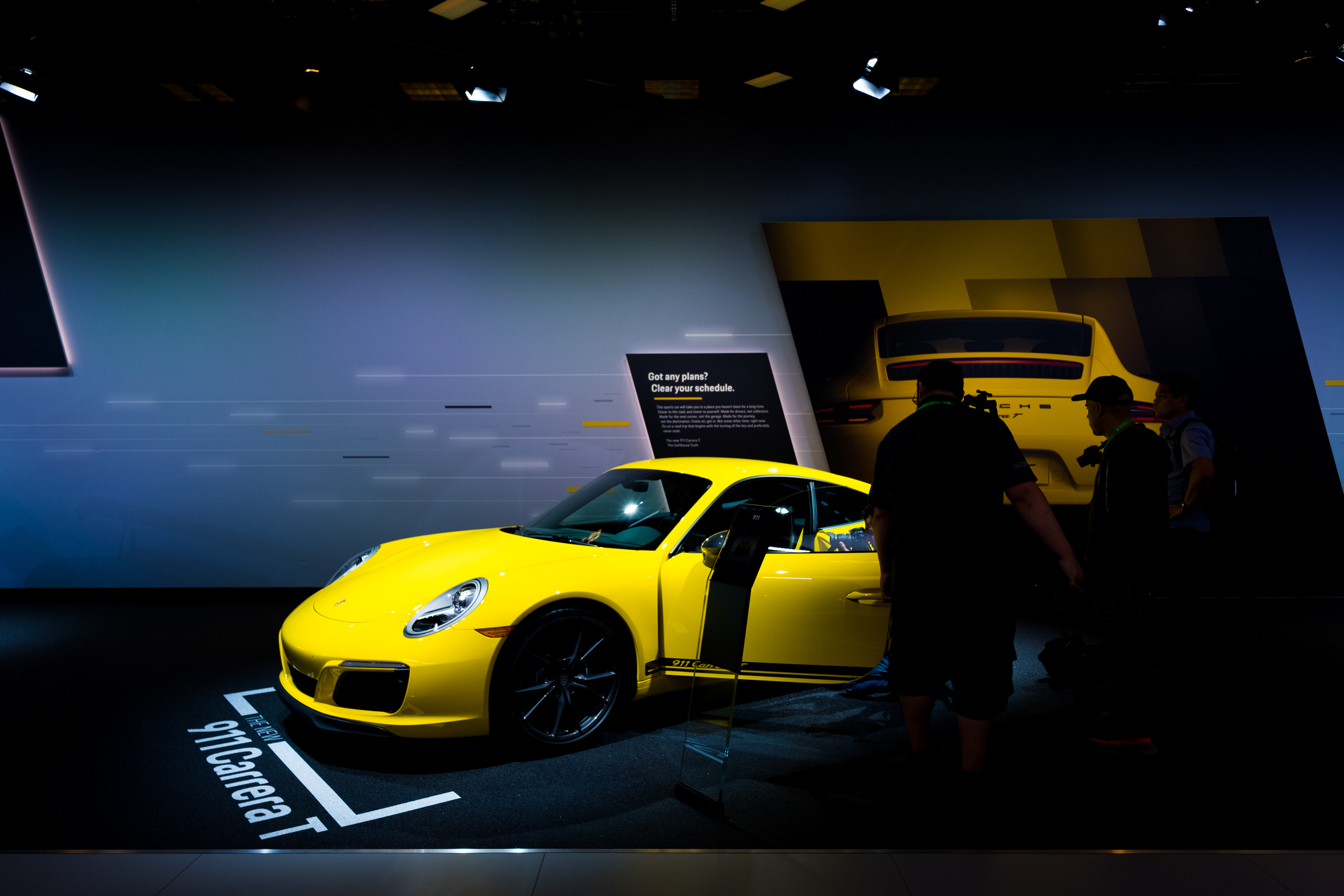 Yellow Porsche on display at the LA Auto Show.