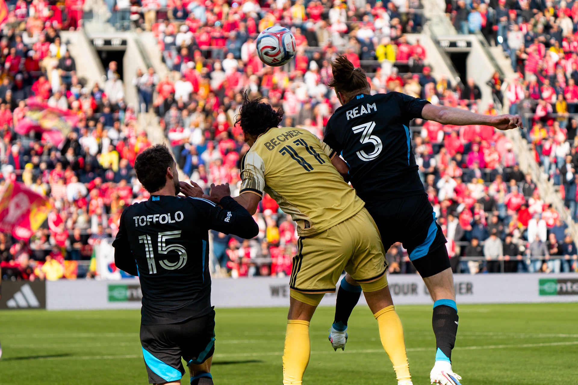 St. Louis CITY SC forward Simon Becher (11) heads the ball along with Charlotte FC defender Harry Toffolo (15) and Charlotte FC defender Tim Ream (3) against Charlotte FC.St. Louis City FC vs. FC Charlotte on February 21, 2026 at Energizer Park in St. Louis, MO. Photo by Daniel Laubhan