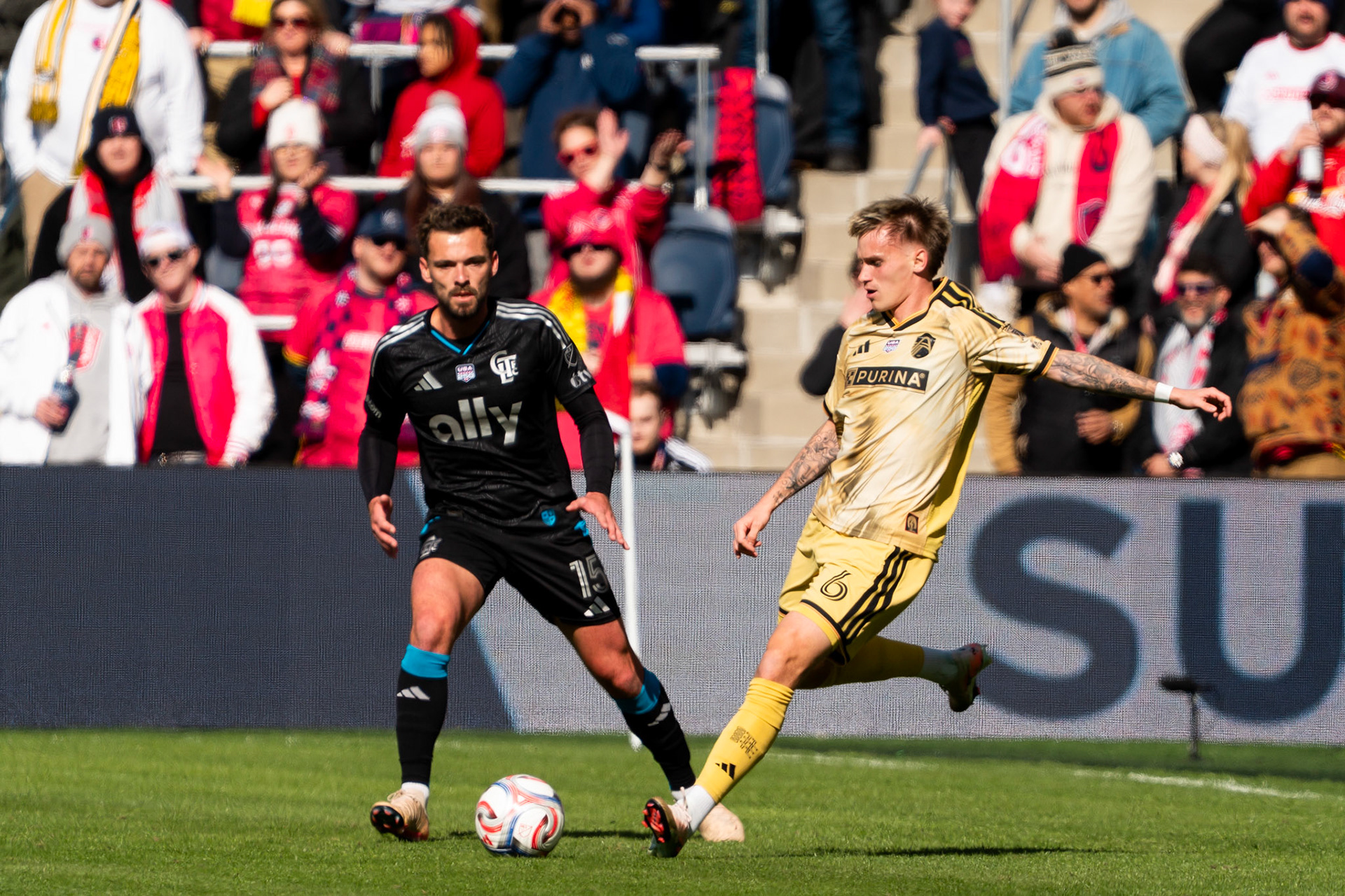 St. Louis CITY SC midfielder Conrad Wallem (6) passes the ball while evading Charlotte FC defender Harry Toffolo (15) against Charlotte FC.St. Louis City FC vs. FC Charlotte on February 21, 2026 at Energizer Park in St. Louis, MO. Photo by Daniel Laubhan