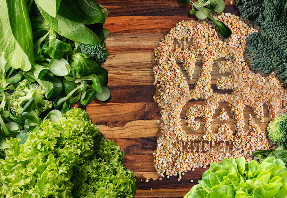 Next, I created the base image in Photoshop: diving "Vegan" into two levels in order to fit onto the cover space, adding vegetable layers over the cutting board and the words "My" and "Kitchen" to the lentils in Bobby Jones Soft Regular font, in a dark brown color to match the cutting board.