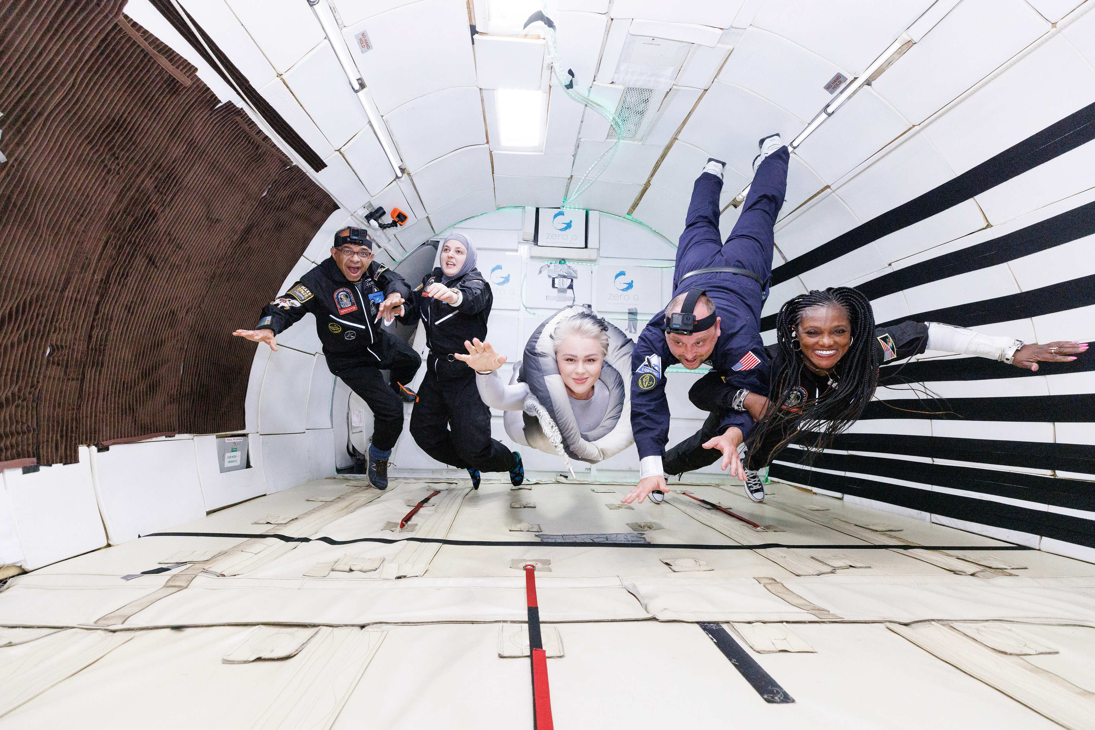 Superhero pose of the AstroAcess ambassadors in zero g. Credit: Zero G Corp and Steve Boxall
