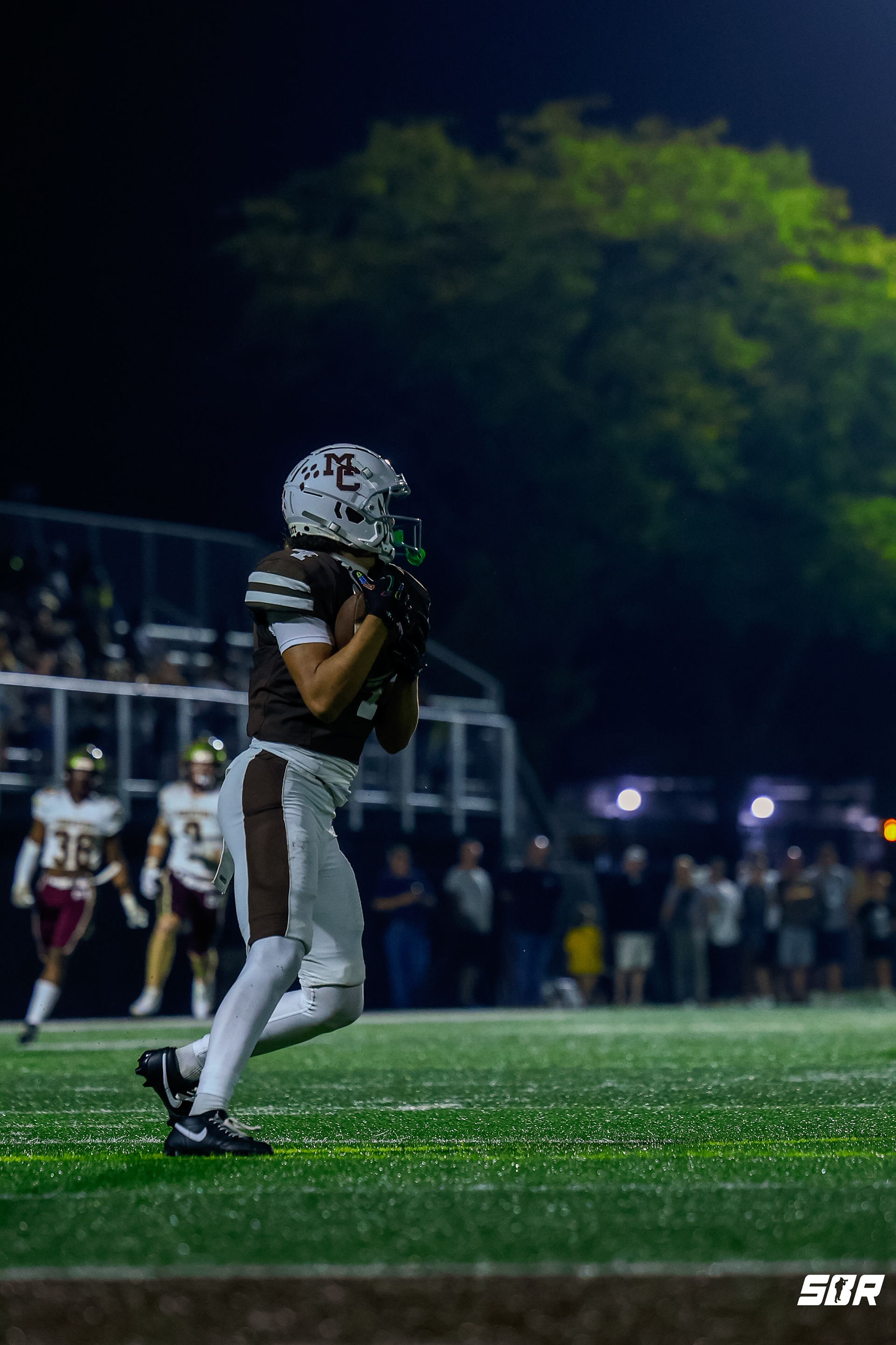 Quinten Burrell (4) catches a kick return to start the game vs St. Ignatius