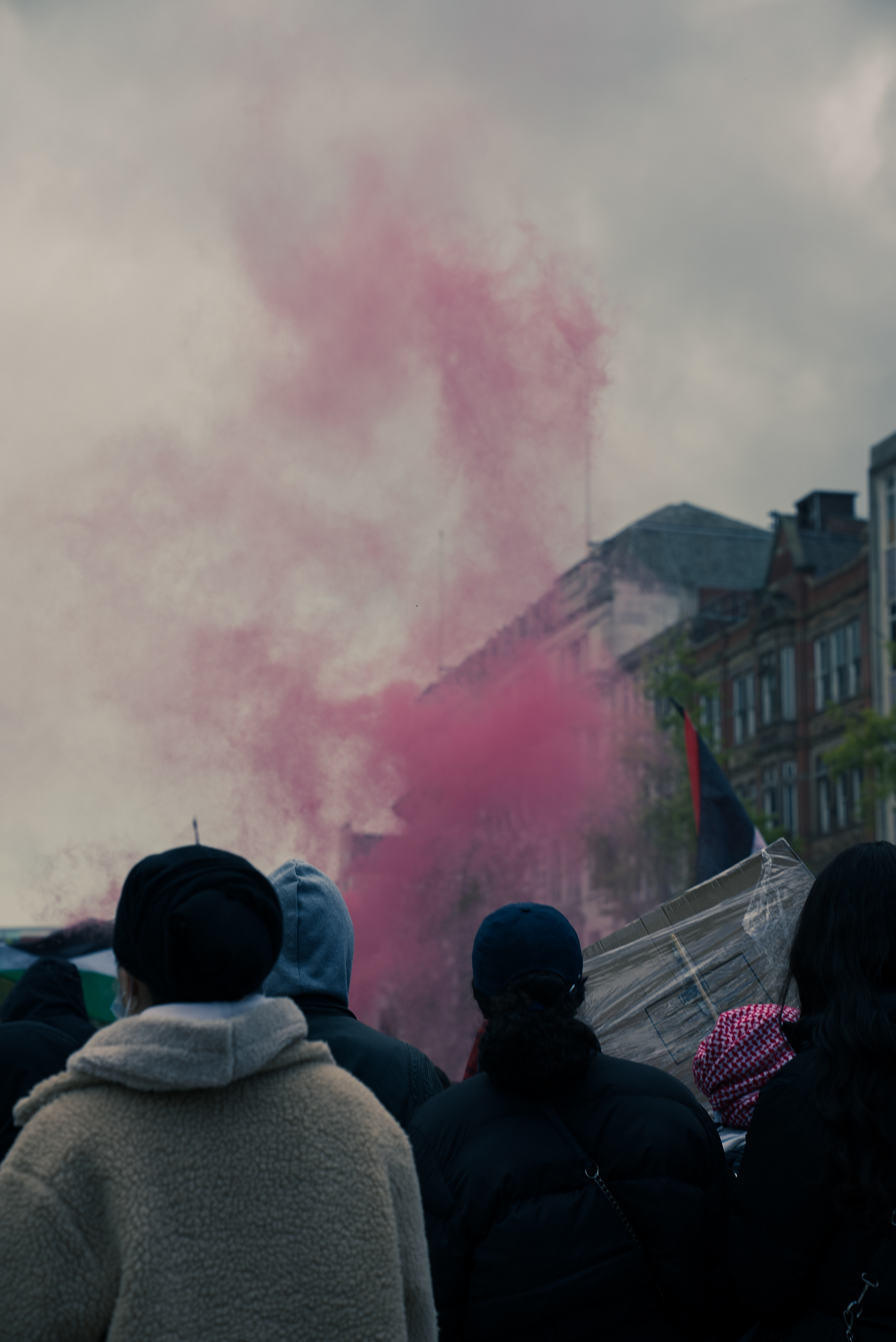 Pink smoke canisters being let off in centre square