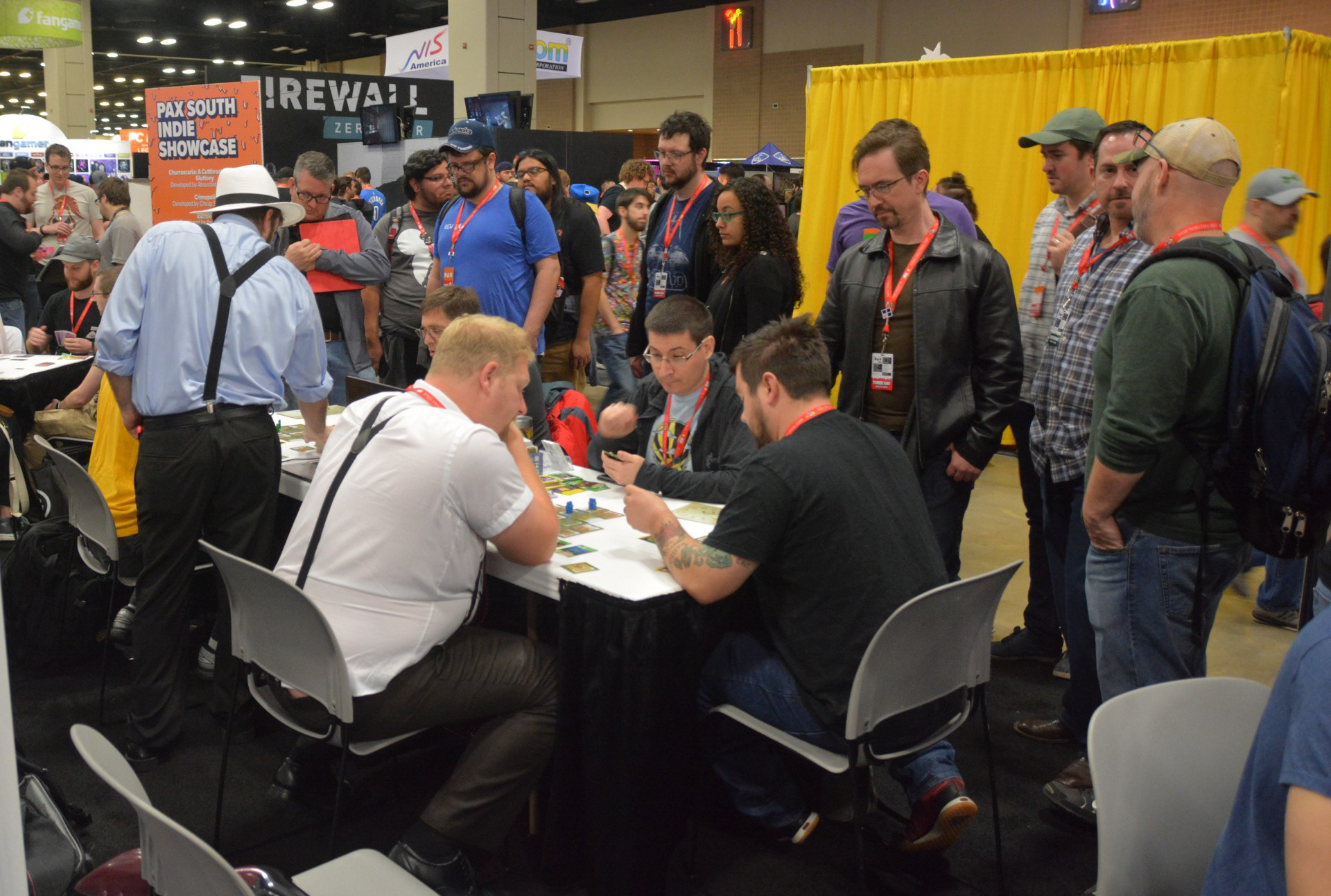 Exhibitors view: two games running with 11 people queuing and spectating