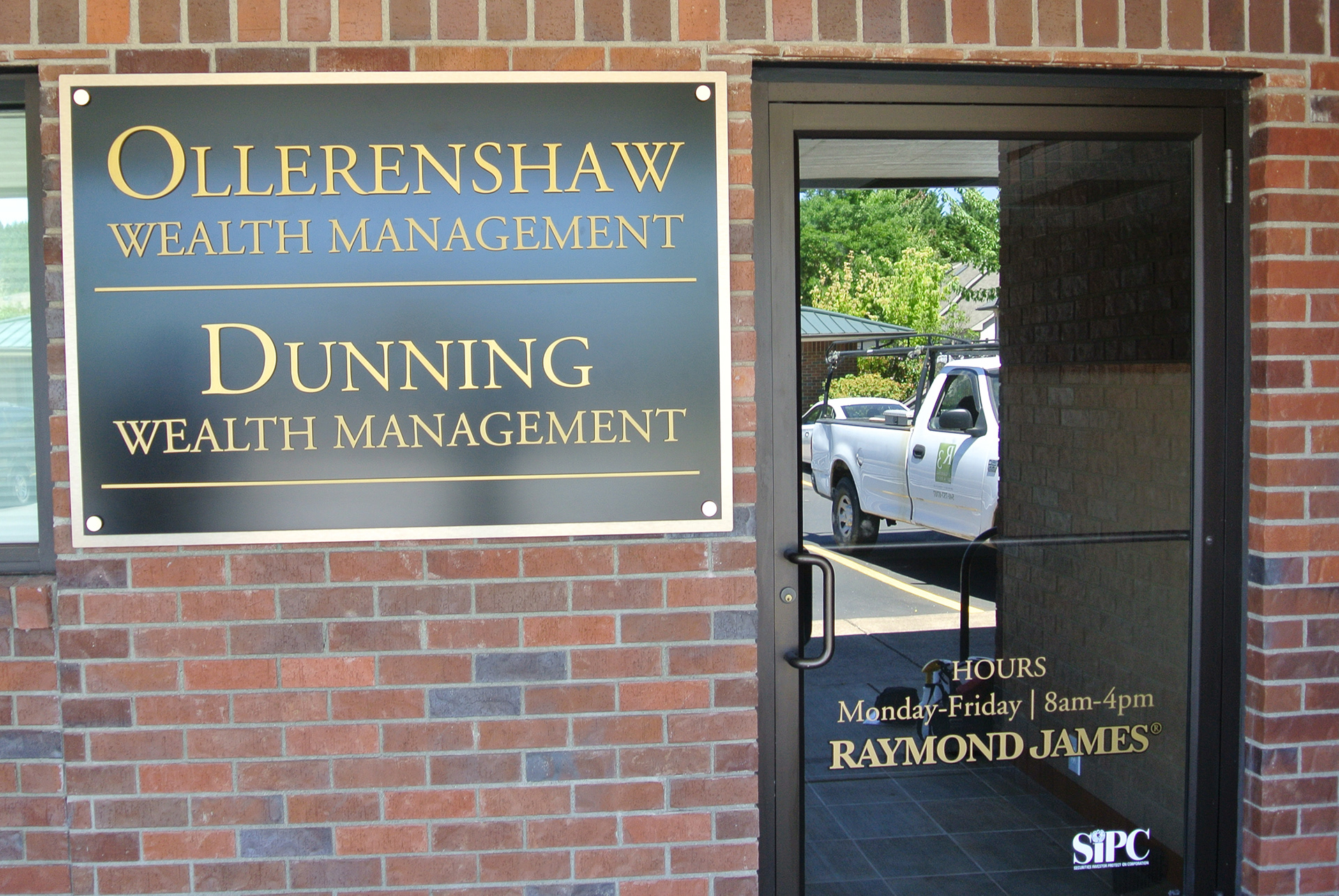 Using dimensional letters, layered acrylic panels, and sign standoffs, I created this building sign with accompanying window vinyl.