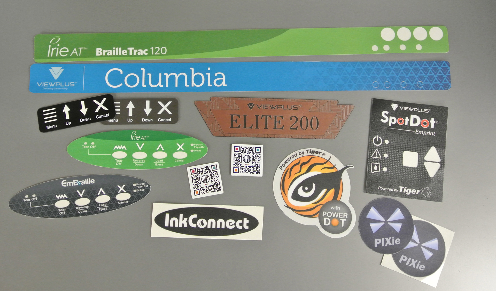 Engraved acrylic, digitally printed, and UV printed labels I designed for a braille printer manufacturer.