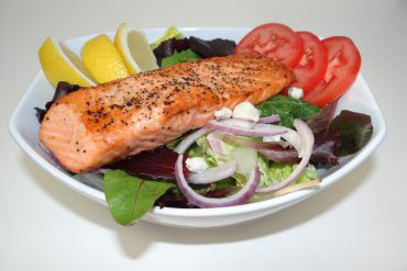 Salmon Salad Grilled salmon fillets served over mixed greens, tomatoes, onions, lemon, Gorgonzola cheese & balsamic vinaigrette dressing.
