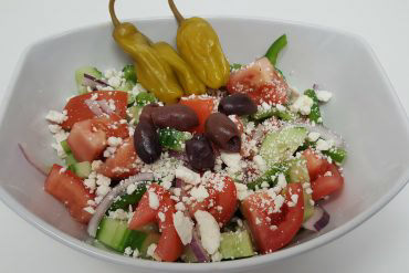 Greek Salad Tomatoes, cucumbers, red onions, pepperoncini, green peppers, feta cheese, and Greek olives with House (Italian) dressing.